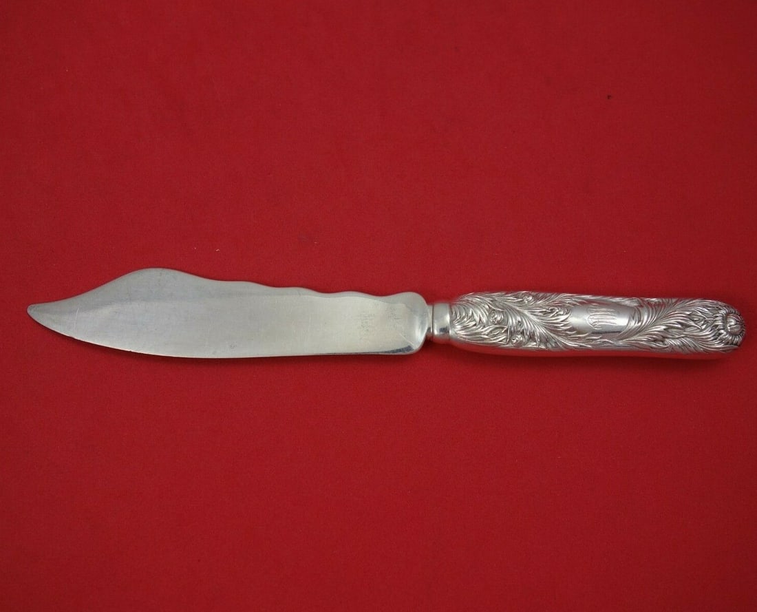 Tiffany & Co Chrysanthemum Sterling Silver Fish Knife Wavy Blade: Tiffany & Co Chrysanthemum Sterling Silver Fish Knife Wavy Blade This exquisite fish knife from Tiffany & Co. features the elegant Chrysanthemum pattern, a hallmark of fine dining. Crafted from sterli