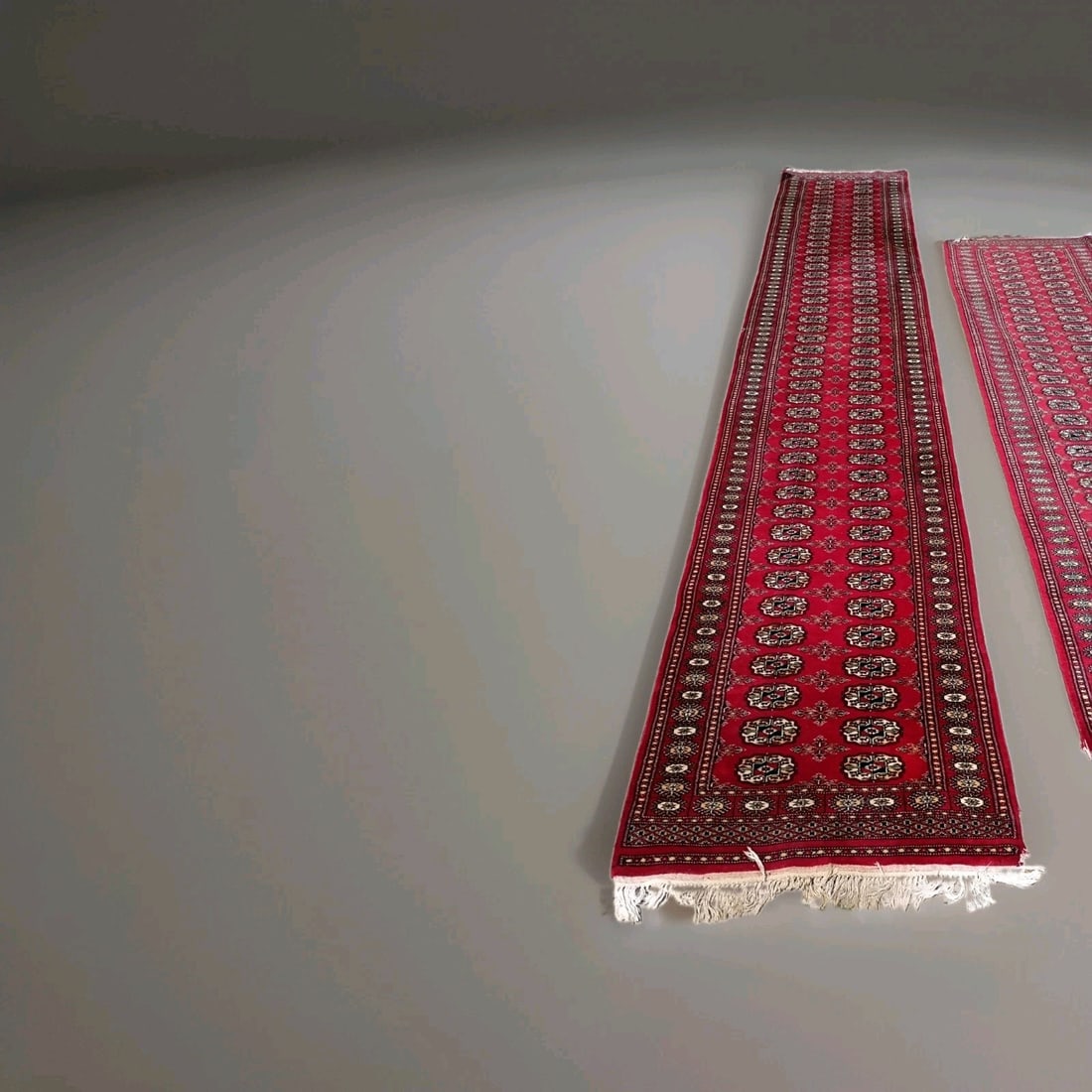 180 x 32 Red Bokhara Wool Runner Rug Hand Knotted: 180 x 32 Red Bokhara Wool Runner Rug Hand Knotted Vintage hand-knotted Bokhara runner rug in red wool with a soft, thick, silky-smooth pile. This long runner is pre-owned and features fringe not inclu