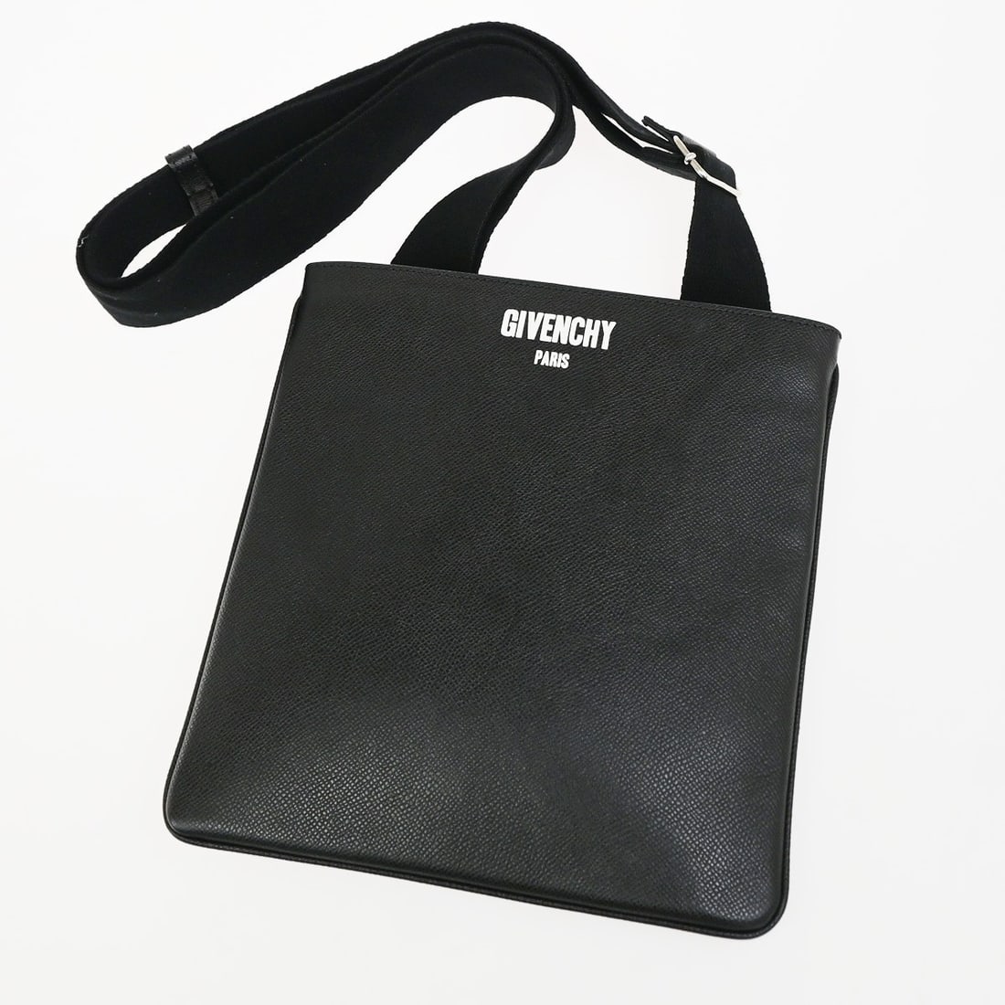 Givenchy Logo Messenger Black Leather Crossbody Bag: Givenchy Logo Messenger Black Leather Crossbody Bag Givenchy Logo Messenger is a unisex leather messenger bag in black. It was made in Romania and is described as being in very good, pristine conditio