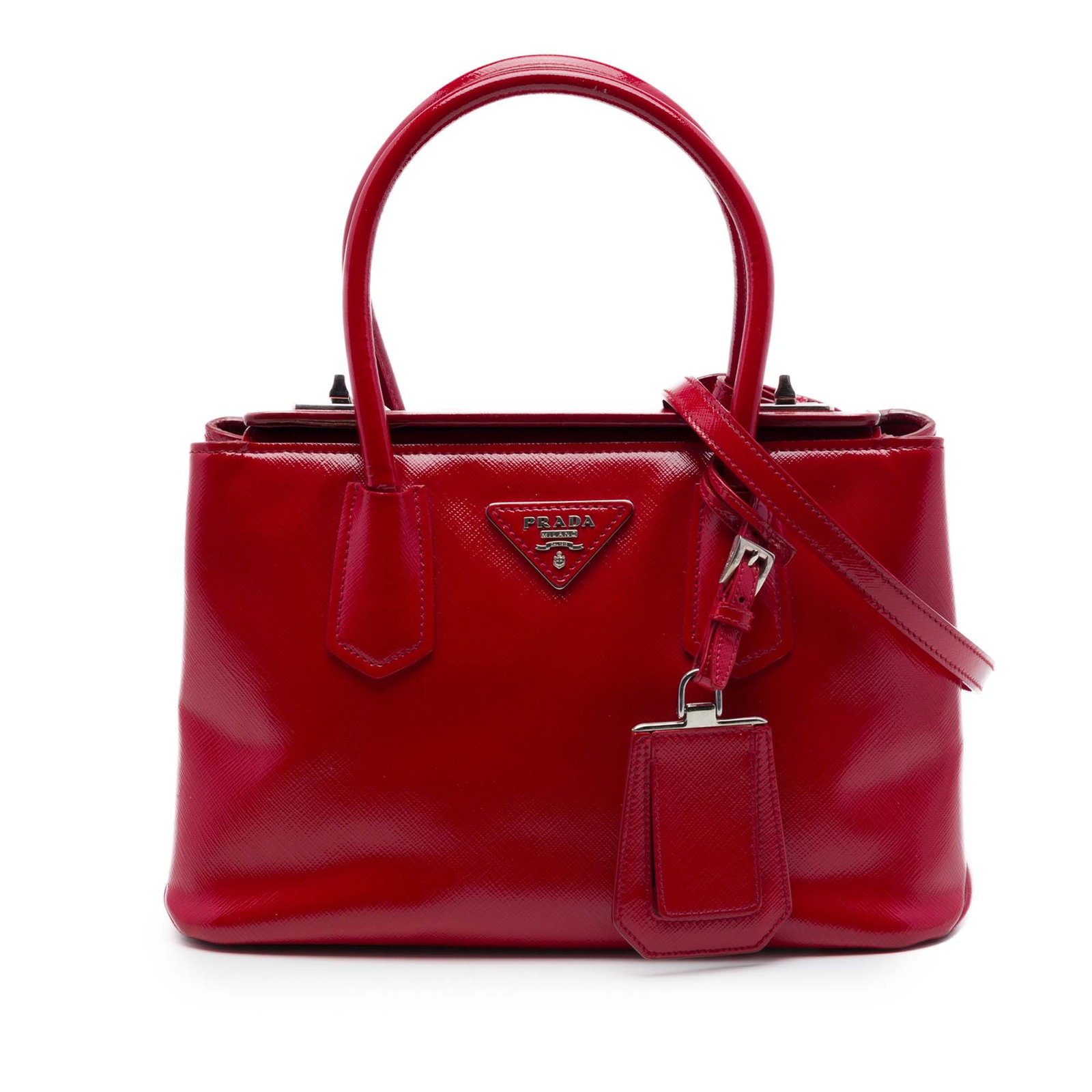 Prada Small Turnlock Twin Satchel Red Saffiano Vernice Leather: Prada Small Turnlock Twin Satchel Red Saffiano Vernice Leather Prada Small Saffiano Vernice Turnlock Twin Satchel in red leather with rolled top handles, a detachable flat leather strap, and a fold-ov