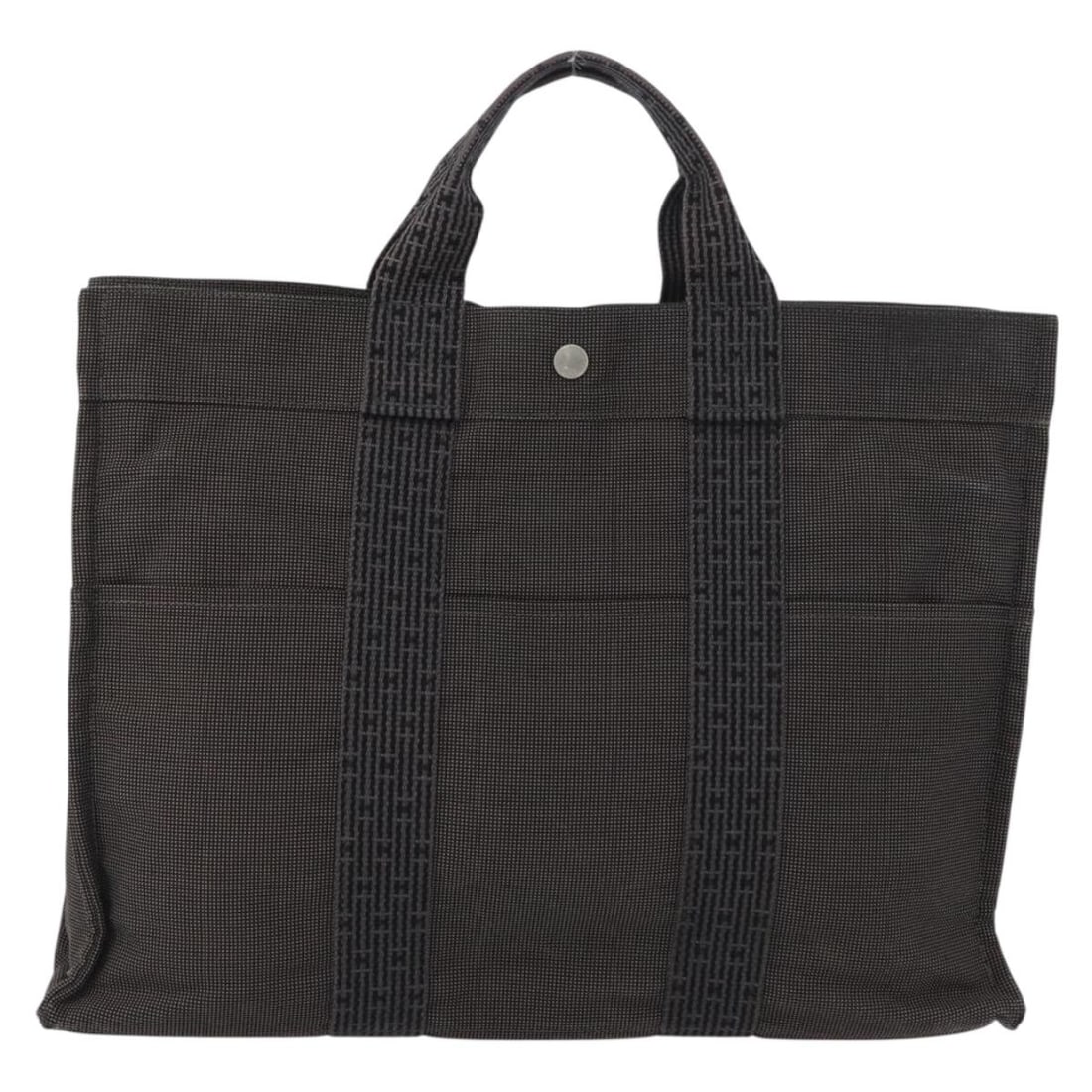 Herline canvas tote gray 42cm by 32cm by 10cm from Hermes: Herline canvas tote gray 42cm by 32cm by 10cm from Hermes The Hermes Fourre-tout Herline is a women's gray canvas bag featuring a spacious design. The bag shows some signs of use including surface rub