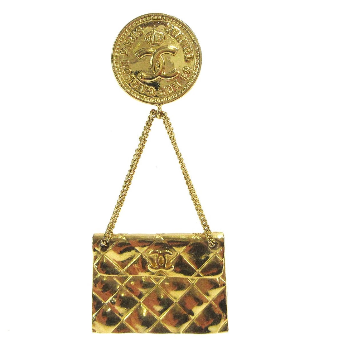 Chanel CC Quilted Bag Motif Gold Plated Brooch Pin: Chanel CC Quilted Bag Motif Gold Plated Brooch Pin Gold-tone Chanel brooch pin with a CC quilted bag motif. Made in France, this gold-plated piece features a handbag-inspired design. Condition shows r