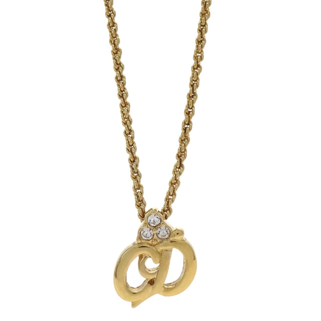 Dior Gold Plated Pendant Necklace with Rhinestone Charm: Dior Gold Plated Pendant Necklace with Rhinestone Charm Vintage Christian Dior pendant necklace in gold-plated metal with a rhinestone charm. This necklace features a classic pendant style and is pres