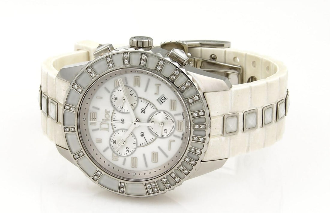 Christian Dior Christal women's quartz watch steel white rubber diamond bezel: Christian Dior Christal women's quartz watch steel white rubber diamond bezel Pre-owned Christian Dior Christal quartz watch with an oversized stainless steel case, white rubber strap, and diamond-acc