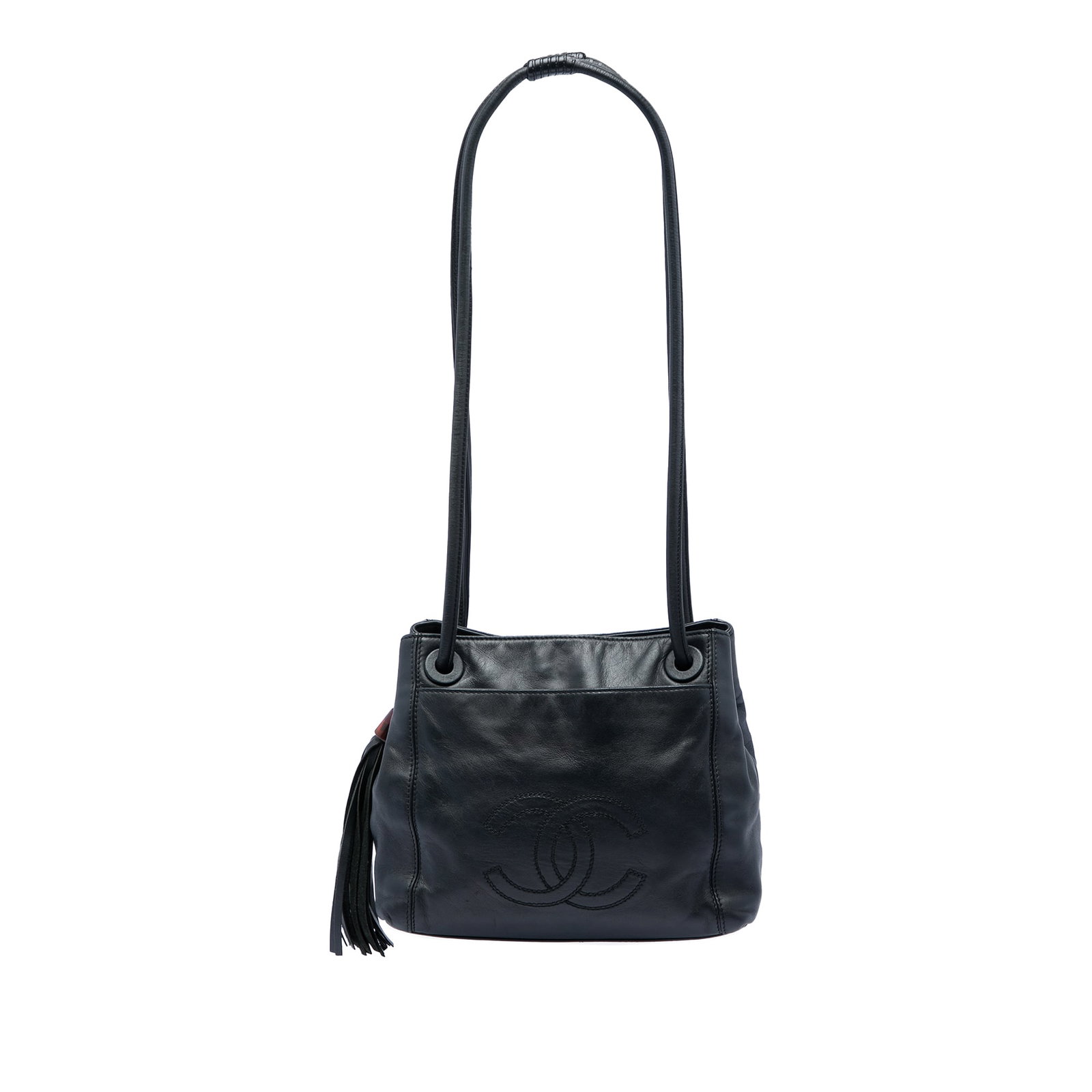 Chanel CC Tassel Shoulder Bag in Black Lambskin: Chanel CC Tassel Shoulder Bag in Black Lambskin Chanel CC Lambskin Tassel Shoulder Bag in black lambskin leather. This shoulder bag features rolled leather straps, an open top with snap closure, an ex