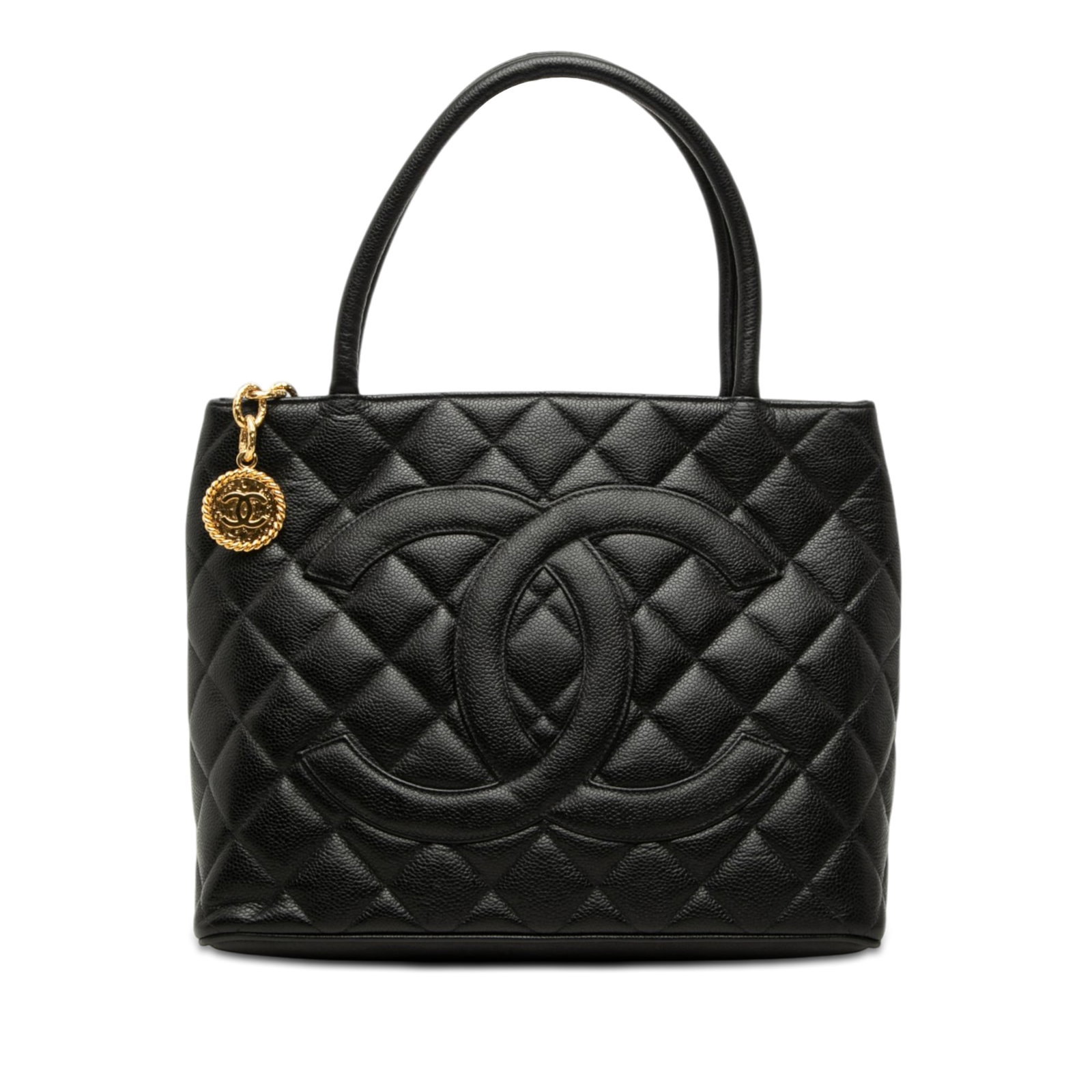 Chanel Medallion Tote in Black Caviar Leather: Chanel Medallion Tote in Black Caviar Leather Chanel Medallion tote crafted in quilted caviar leather with rolled leather handles and a top zip closure. The bag includes an exterior back slip pocket a