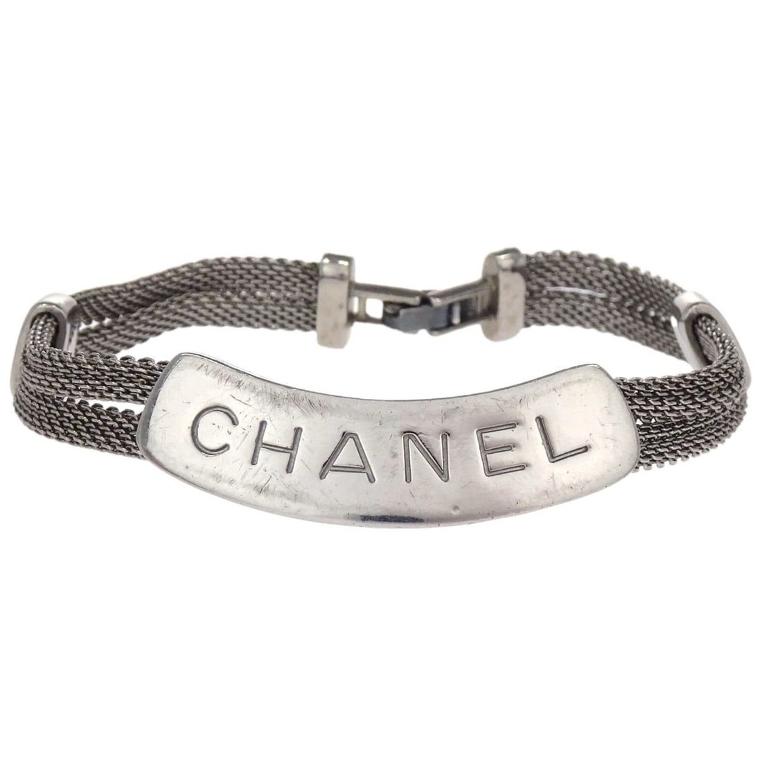 CHANEL 98P silver plated logo plate bracelet France: CHANEL 98P silver plated logo plate bracelet France Chanel logo plate bracelet in silver plated metal, made in France. This bracelet has a classic streamlined design and shows scratches and discolorat