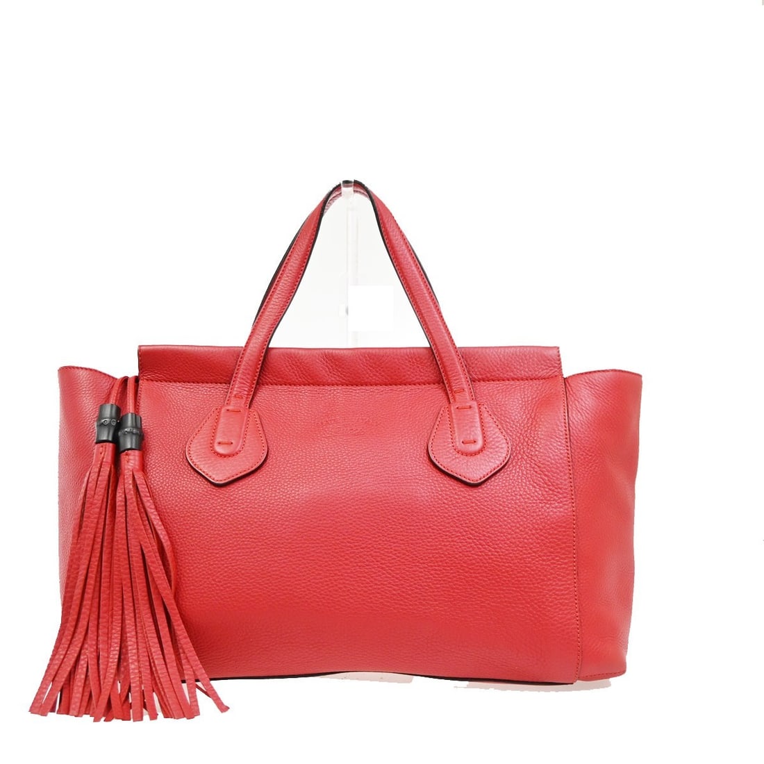 Gucci Lady Tassel Top Handle Red Leather Handbag: Gucci Lady Tassel Top Handle Red Leather Handbag Gucci Lady Tassel Top Handle bag in red leather. This women's handbag is made in Italy and features a good overall condition with visible signs of prio