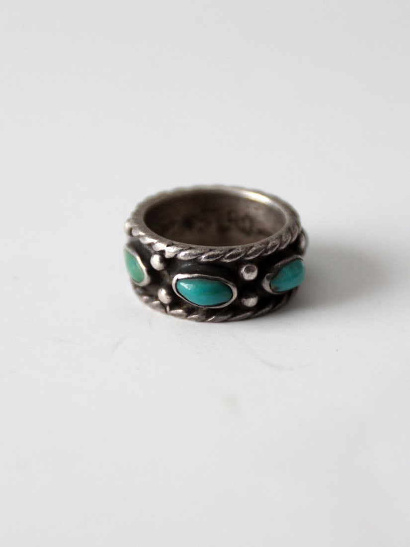 Statement Band Sterling Silver Turquoise Ring Size 6.5 Vintage Jewelry: Statement Band Sterling Silver Turquoise Ring Size 6.5 Vintage Jewelry This vintage sterling silver ring showcases a bold statement band design adorned with multiple turquoise stones in vivid blue and