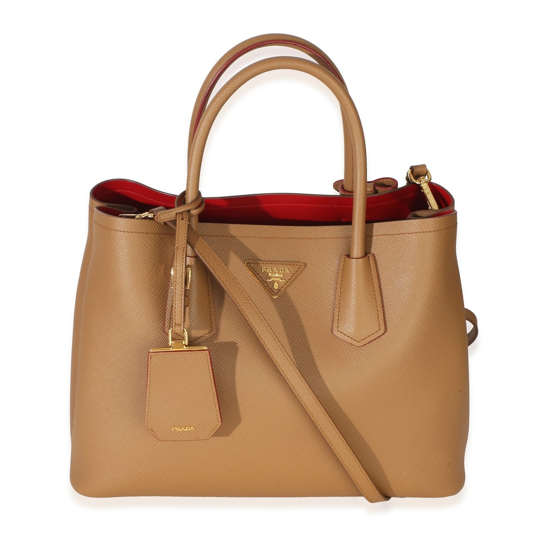 Prada Cuir Tote Medium Brown Leather Handbag with Dustbag: Prada Cuir Tote Medium Brown Leather Handbag with Dustbag Prada Cuir Tote in leather with a brown exterior and red leather lining. This medium tote features an open top design, gold-tone hardware, and