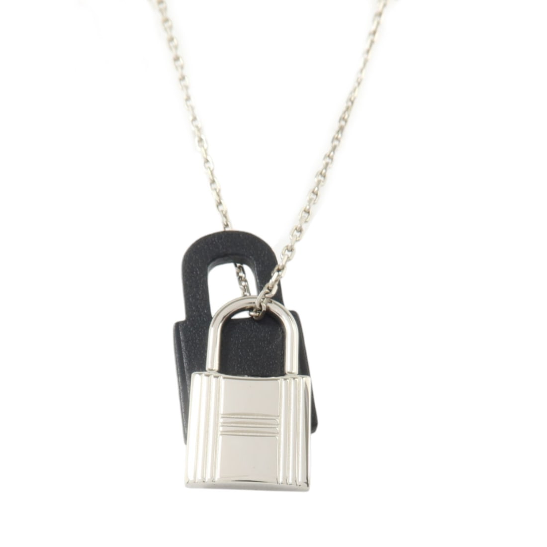 Hermes O'Kelly Swift Leather Necklace Silver Tone Black: Hermes O'Kelly Swift Leather Necklace Silver Tone Black Hermes O'Kelly necklace for women crafted in black Vaux Swift leather and calfskin with silver-tone metal accents. This necklace includes a stor