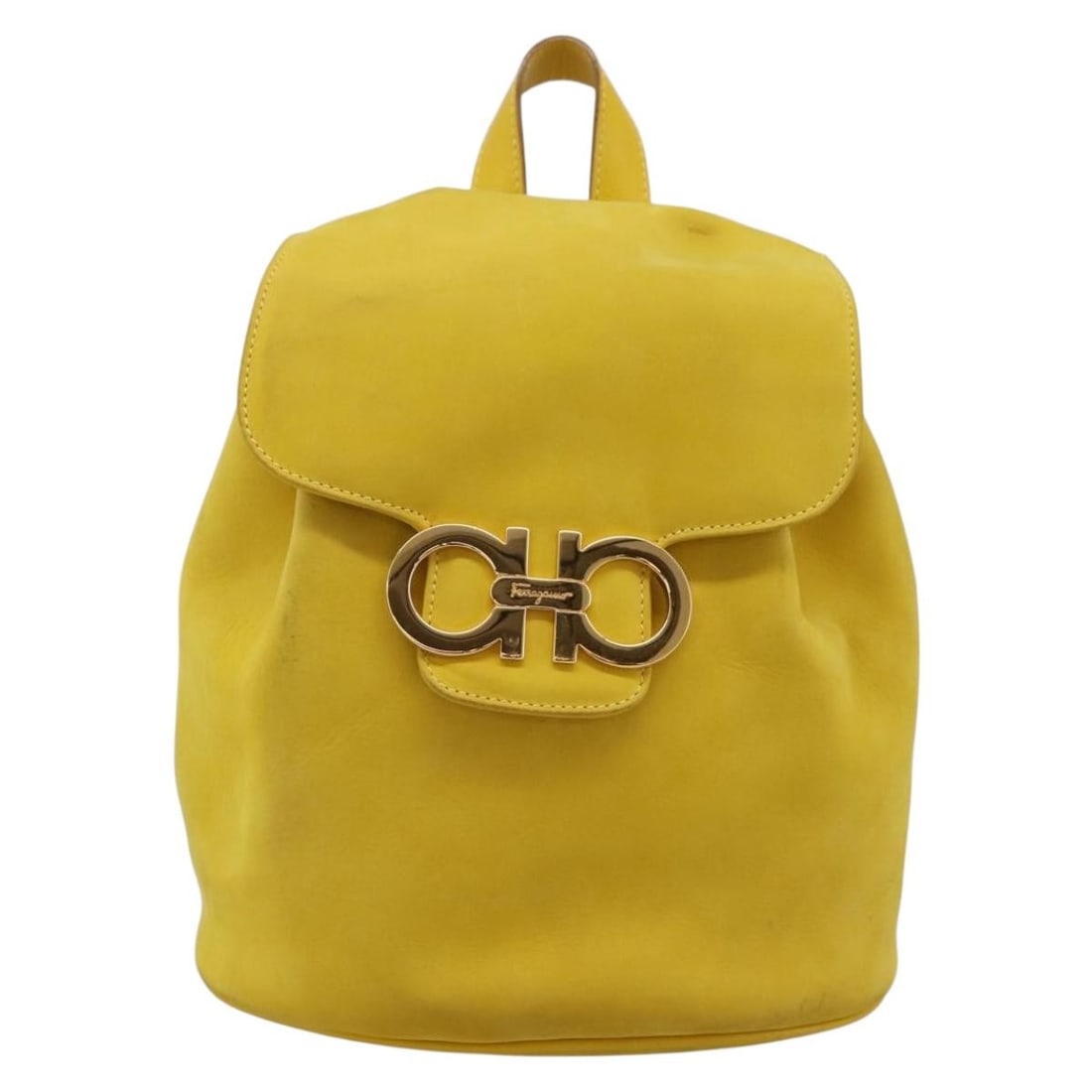Salvatore Ferragamo Gancini yellow suede handbag: Salvatore Ferragamo Gancini yellow suede handbag Salvatore Ferragamo Gancini suede bag in yellow. Made in Italy, this women's bag features a suede exterior and shows overall good condition with light 
