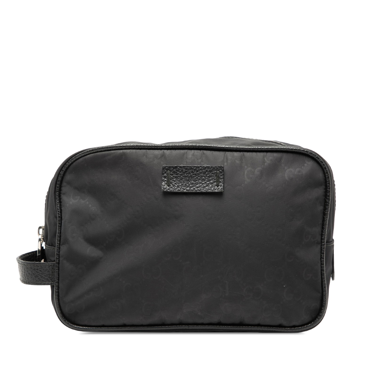Black Nylon Toiletry Case with Leather Trim by Gucci GG: Black Nylon Toiletry Case with Leather Trim by Gucci GG This Gucci GG Nylon Toiletry Pouch features a durable nylon body with leather trim and a flat leather side handle. It is designed with a top zip