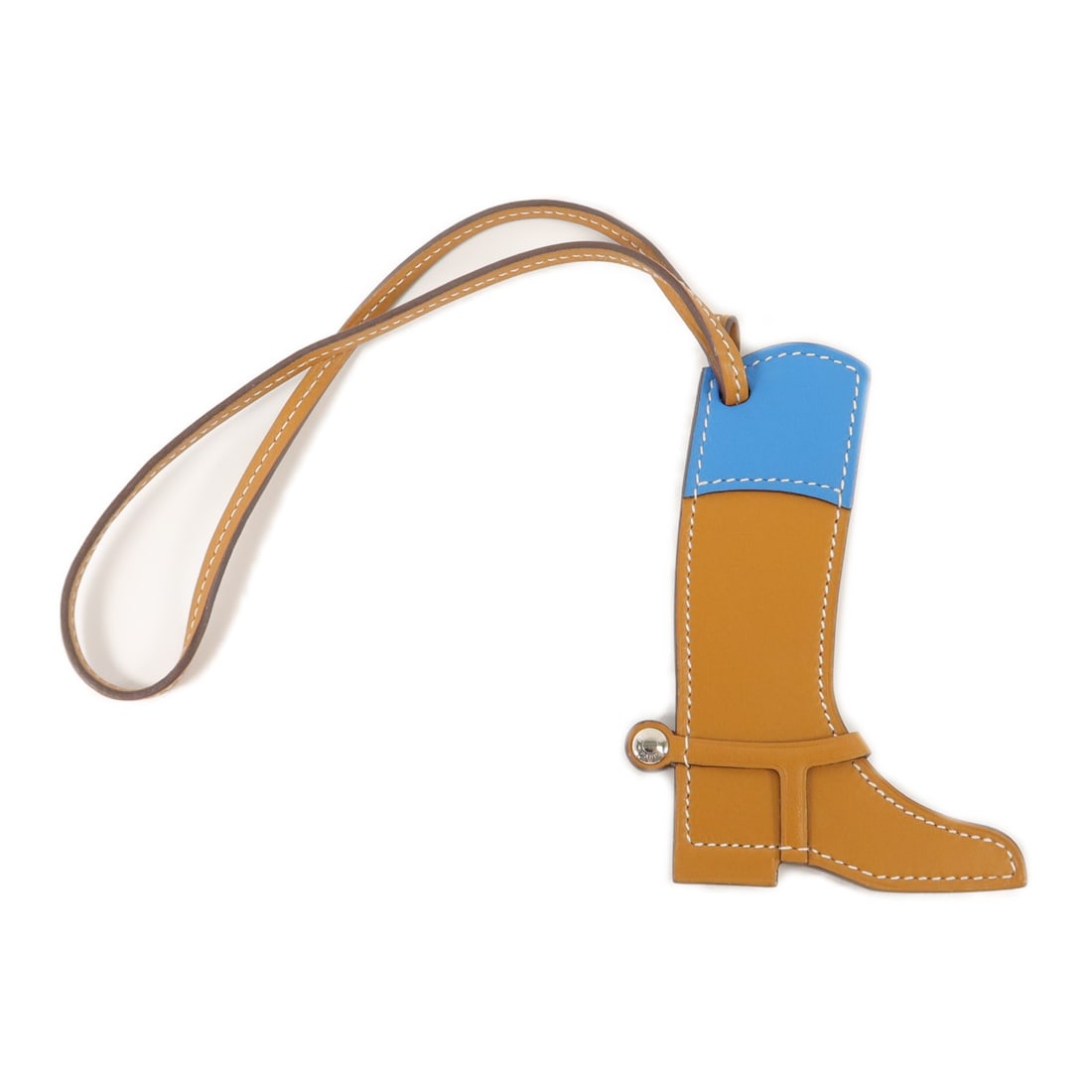 Hermes Paddock Boot Charm Swift Calfskin Mykonos Blue Gold Tone: Hermes Paddock Boot Charm Swift Calfskin Mykonos Blue Gold Tone Hermes Paddock Boot charm crafted in calfskin with a brown, blue, and gold color combination, including Mykonos Blue accents. Made in Fr