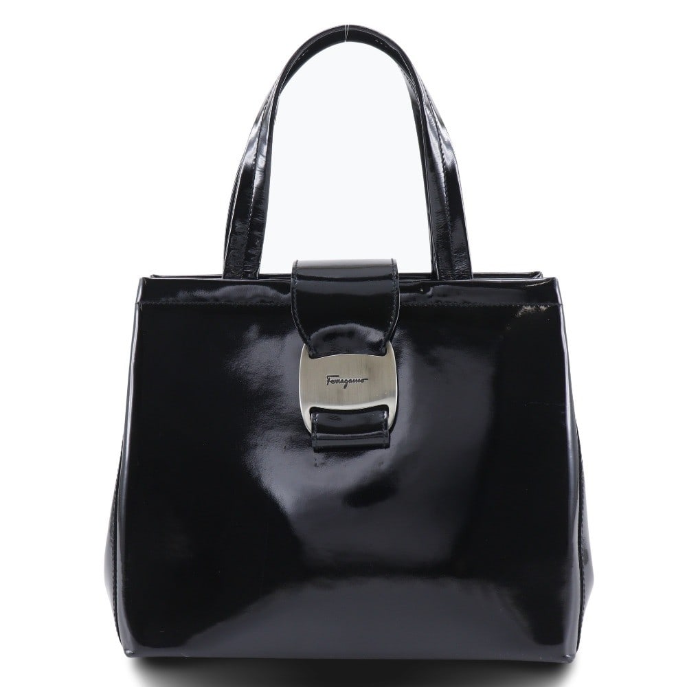 Black Patent Leather Vara Bow Tote by Salvatore Ferragamo: Black Patent Leather Vara Bow Tote by Salvatore Ferragamo This Salvatore Ferragamo Convertible Vara Bow Tote is crafted from black patent leather and features the signature Vara bow detail. Designed f