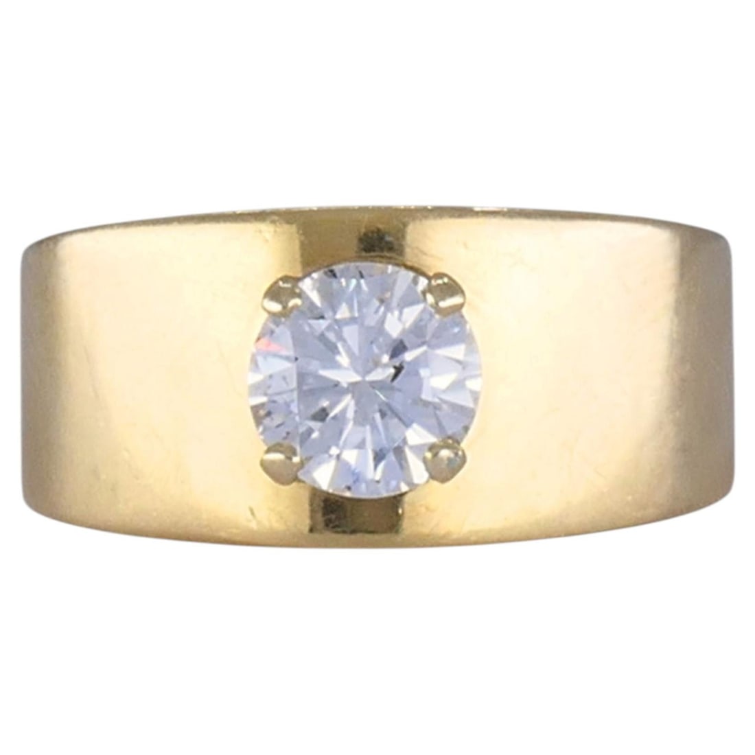 1970s Modernist 14k Yellow Gold Diamond Solitaire Ring Wide Band: 1970s Modernist 14k Yellow Gold Diamond Solitaire Ring Wide Band Vintage 1970s solitaire diamond ring crafted in 14k yellow gold, featuring a wide polished band and a single round brilliant cut diamon