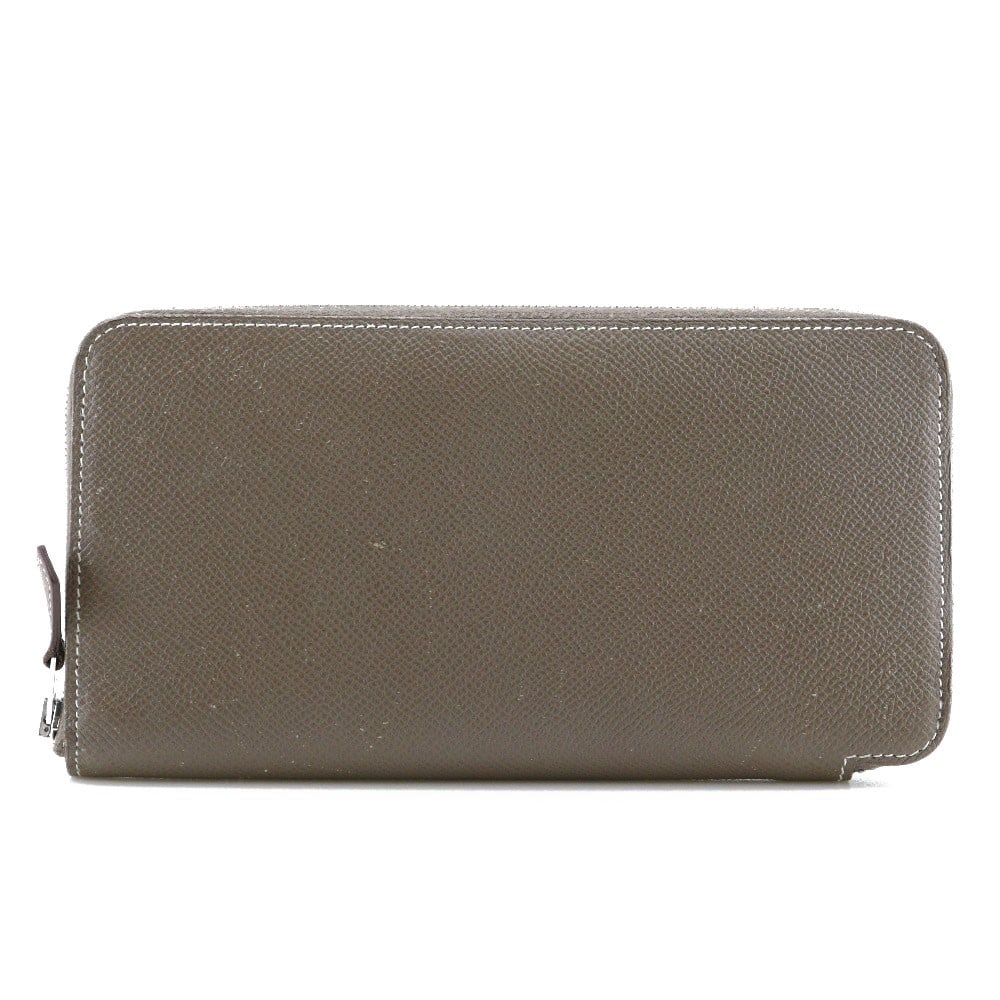 Hermes Azap Zip Around Beige Leather Wallet: Hermes Azap Zip Around Beige Leather Wallet This Hermes Azap Zip Around Wallet for women features a beige Epsom leather exterior with minor scratches, corner thread wear, and light fluffing. The inter
