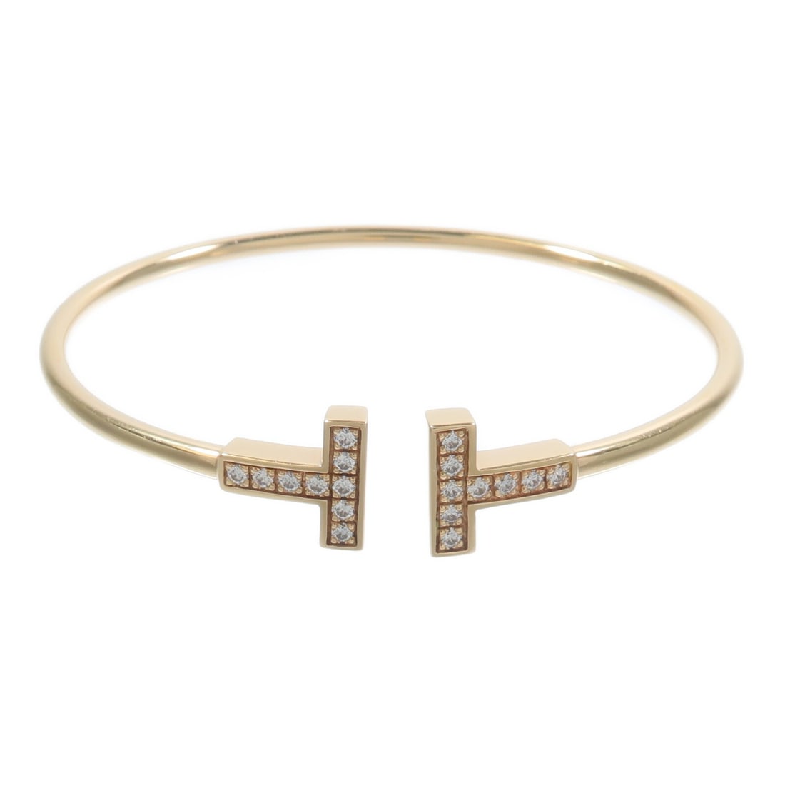 Tiffany and Co T Wire Bracelet 18K Yellow Gold Diamond: Tiffany and Co T Wire Bracelet 18K Yellow Gold Diamond Tiffany & Co. T Wire Diamond bracelet crafted in 18K yellow gold with diamonds. This women's bracelet includes a storage box and case and is note