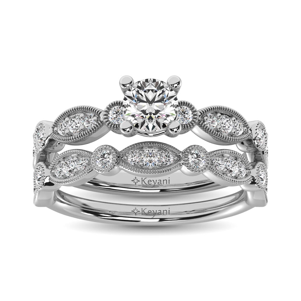 Diamond 1/2 Ct.Tw. Bridal Ring in 14K White Gold: Diamond 1/2 Ct.Tw. Bridal Ring in 14K White Gold 14k White Gold Stone Color: G-h Stone Clarity: Si2 Each ring is presented in standard size 6.5. Complimentary resizing is available between sizes 510 (