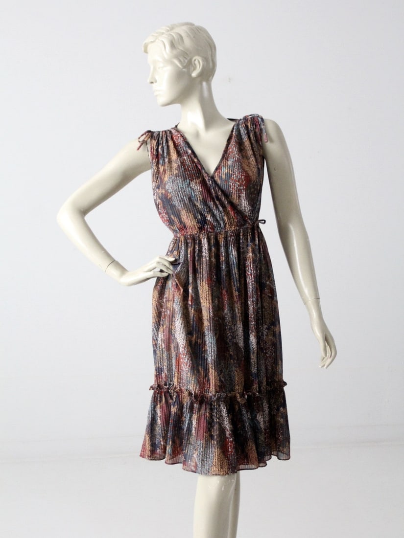 1970s Phase II Floral Faux Wrap Dress with Belt: 1970s Phase II Floral Faux Wrap Dress with Belt Discover a stunning piece from the 1970s with this Phase II faux wrap dress. This semi-sheer, flowy garment features exquisite small pin tucks and a vib