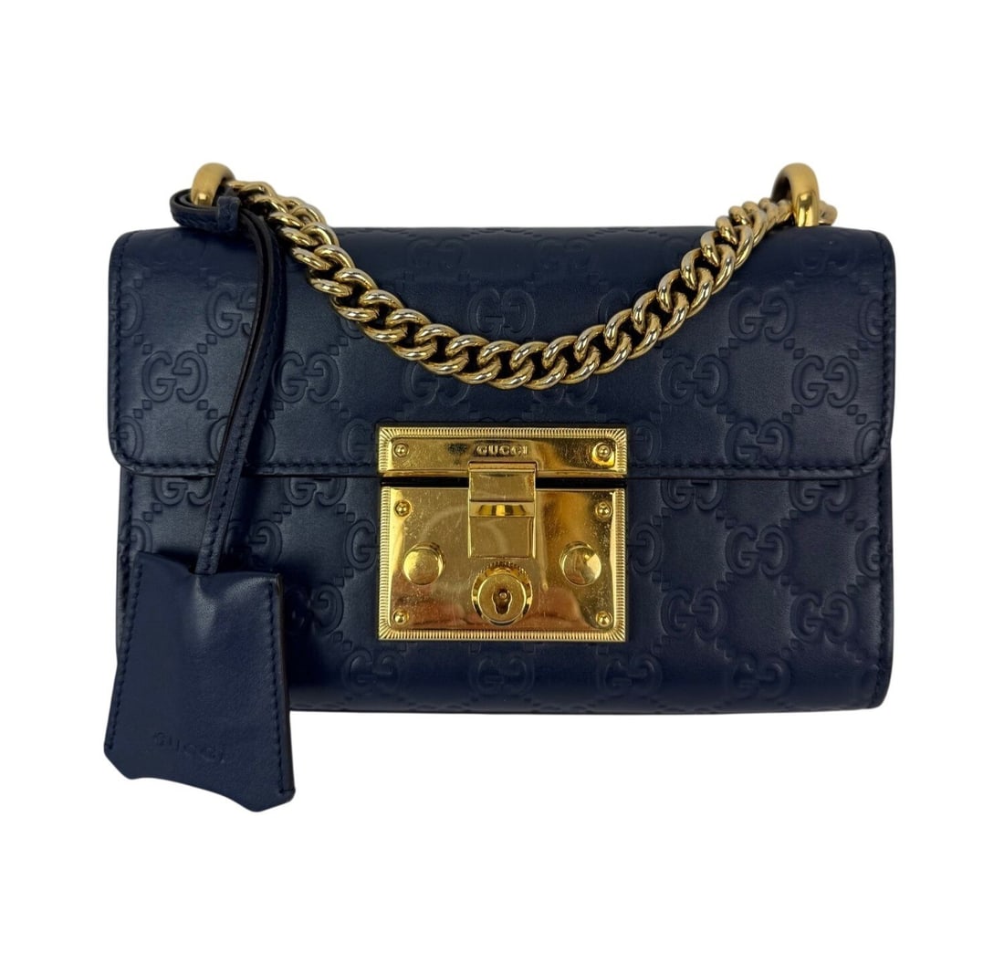 Gucci Padlock GG Supreme Blue Monogram Small Leather Chain Shoulder Bag: Gucci Padlock GG Supreme Blue Monogram Small Leather Chain Shoulder Bag This Gucci GG Supreme Small Padlock shoulder bag features a blue leather exterior with a monogram pattern and a coated finish. D