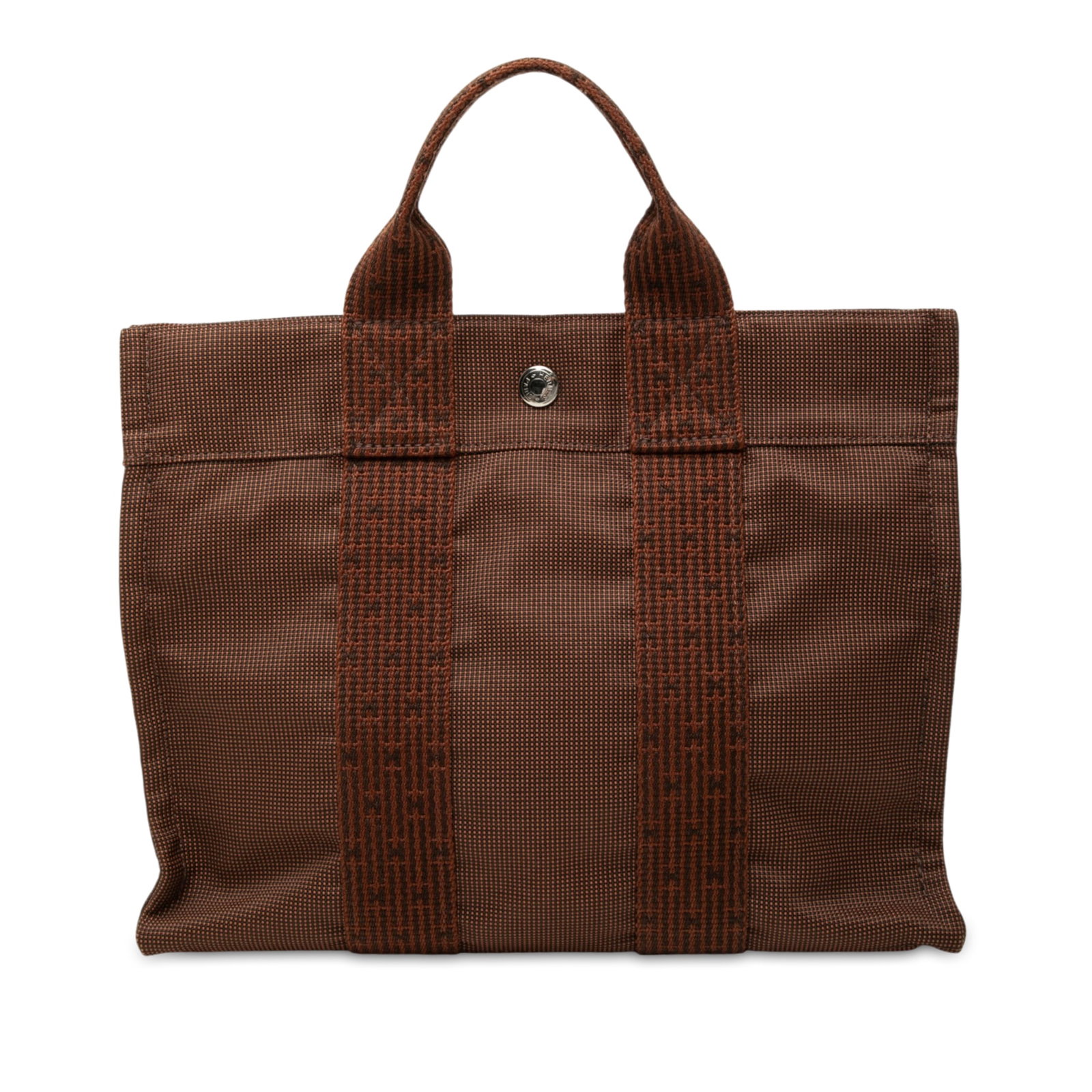 Hermes Herline PM Brown Canvas Tote Bag: Hermes Herline PM Brown Canvas Tote Bag Hermes Herline PM bag in brown canvas with flat straps, a top snap closure, and an interior zip compartment. Made in France. Condition is rated B+ with noted we