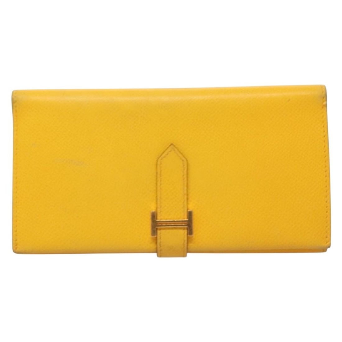Hermes Bearn yellow leather wallet: Hermes Bearn yellow leather wallet The Hermes Bearn Wallet is crafted from yellow leather and designed for women. This pre-owned wallet features metal fittings and originates from France. It shows sig