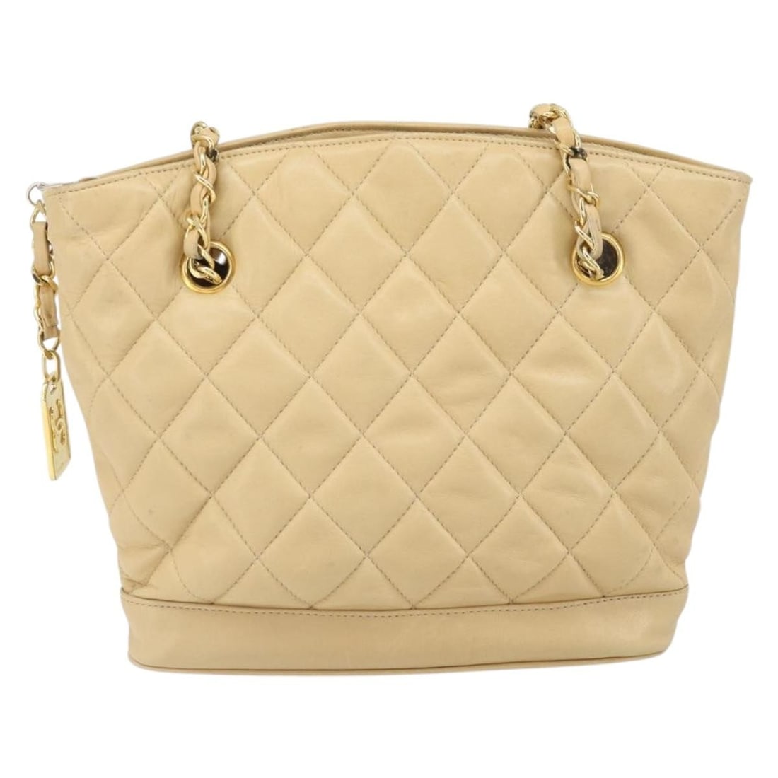 Chanel Vintage CC Leather Shopper Chain Bag: Chanel Vintage CC Leather Shopper Chain Bag This Chanel Vintage CC Chain Shopper is crafted from quilted beige leather and features the iconic CC logo with chain handles. Made in Italy, this shopper i