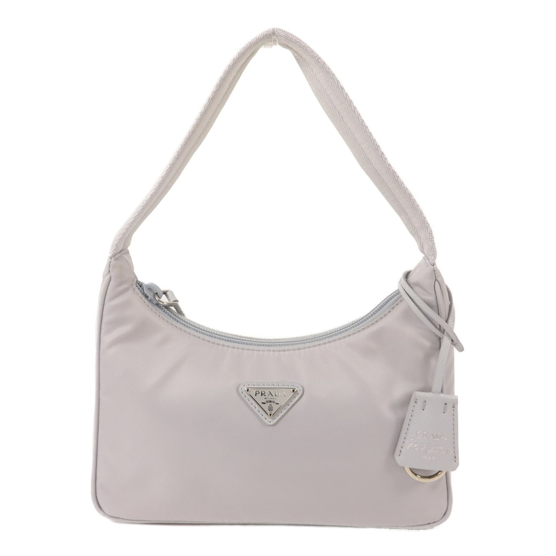 Blue Nylon Mini Hobo Bag PRADA 1NE515 with SHW: Blue Nylon Mini Hobo Bag PRADA 1NE515 with SHW A PRADA SHW Mini Hobo Handbag in blue nylon, model 1NE515. It comes with storage bags, guarantee, and clochette. Condition is AB: Very Good. Specificatio