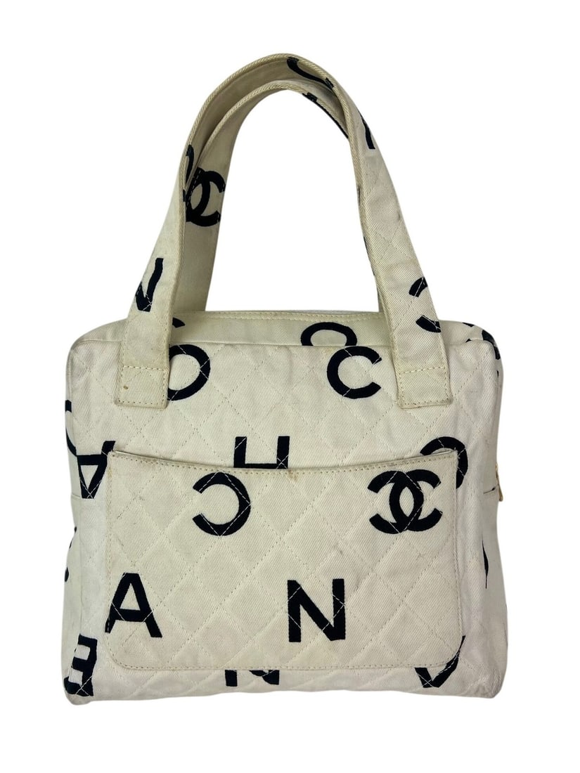 CHANEL Matelasse Vintage Shoulder Bag Ivory Logo Cotton Canvas: CHANEL Matelasse Vintage Shoulder Bag Ivory Logo Cotton Canvas Vintage Chanel Matelasse logo handbag in ivory cotton canvas with a quilted finish and rectangular silhouette. This pre-owned shoulder ba