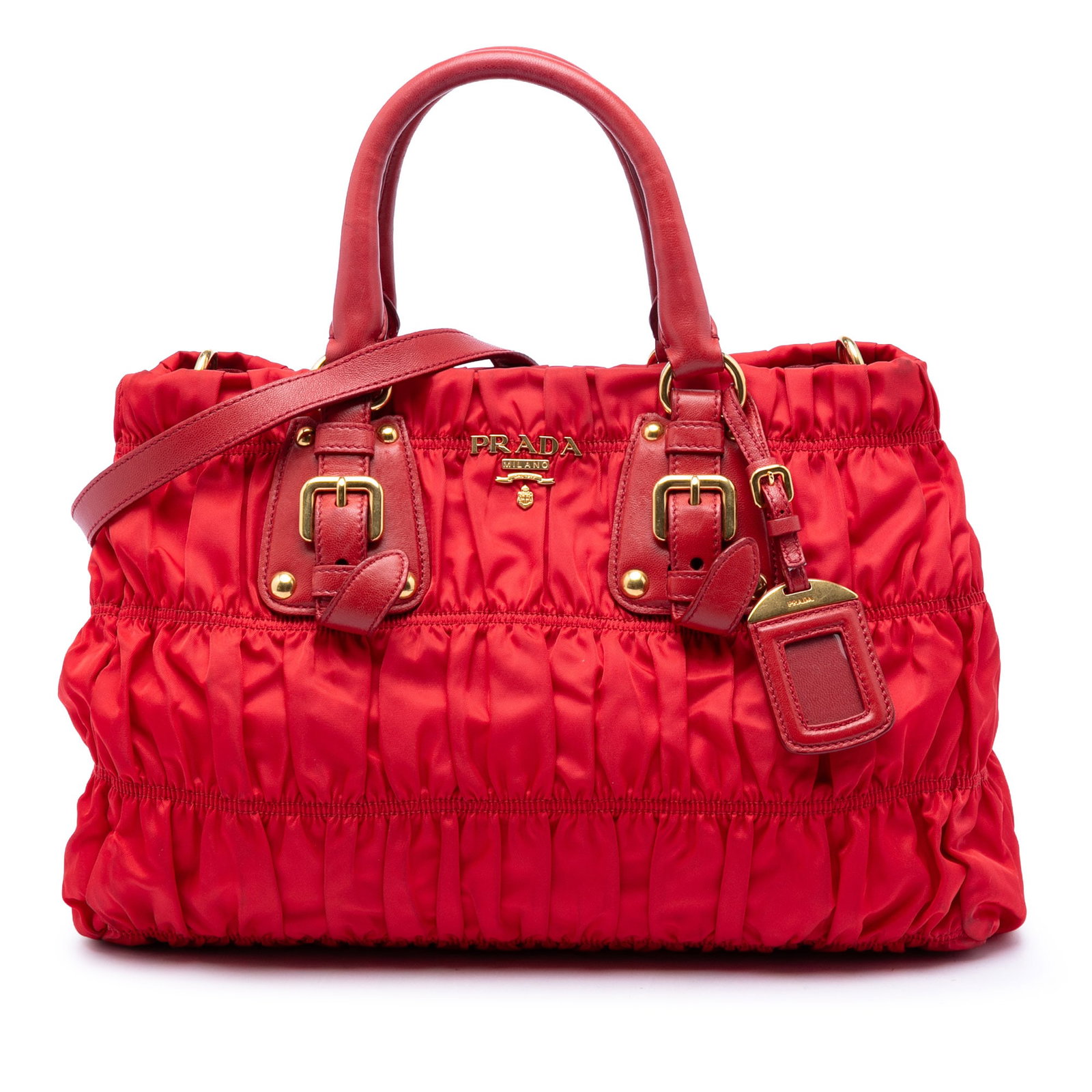 Prada Tessuto Gaufre Red Nylon Satchel Bag: Prada Tessuto Gaufre Red Nylon Satchel Bag Prada Tessuto Gaufre satchel in red with a gathered fabric body, rolled leather handles, and an adjustable, detachable flat leather strap. The open top secur