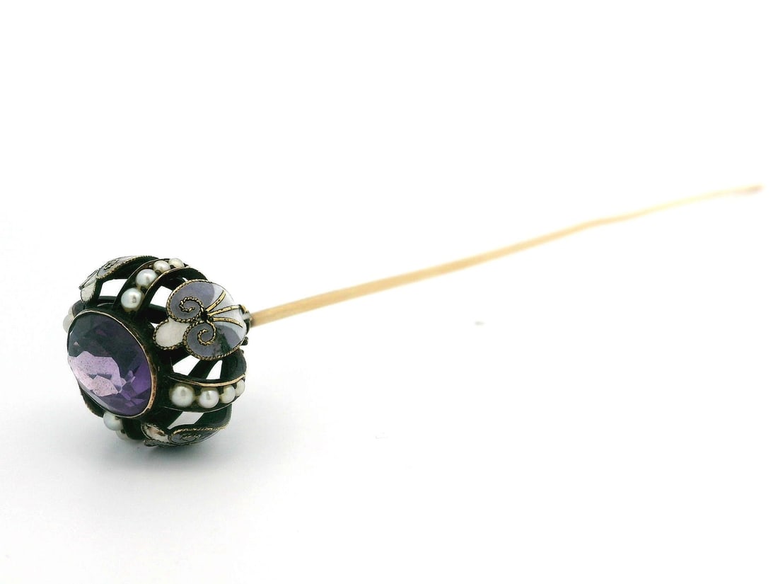 Victorian 14k Yellow Gold Amethyst Seed Pearl Enamel Hat Pin: Victorian 14k Yellow Gold Amethyst Seed Pearl Enamel Hat Pin This exquisite Antique Victorian hat pin combines elegance and craftsmanship, featuring a stunning natural genuine amethyst at its center. 