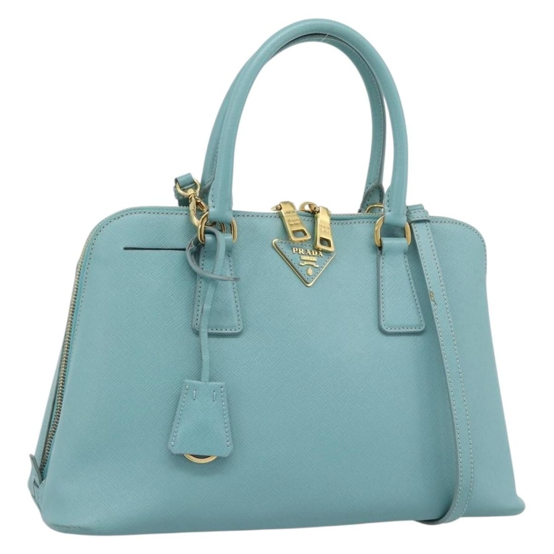 PRADA Saffiano Leather 2Way Handbag Turquoise Blue with Strap: PRADA Saffiano Leather 2Way Handbag Turquoise Blue with Strap Prada 2-way handbag in turquoise blue Saffiano leather with gold-tone accents. Includes a dust bag, clochette, and shoulder strap. Made in