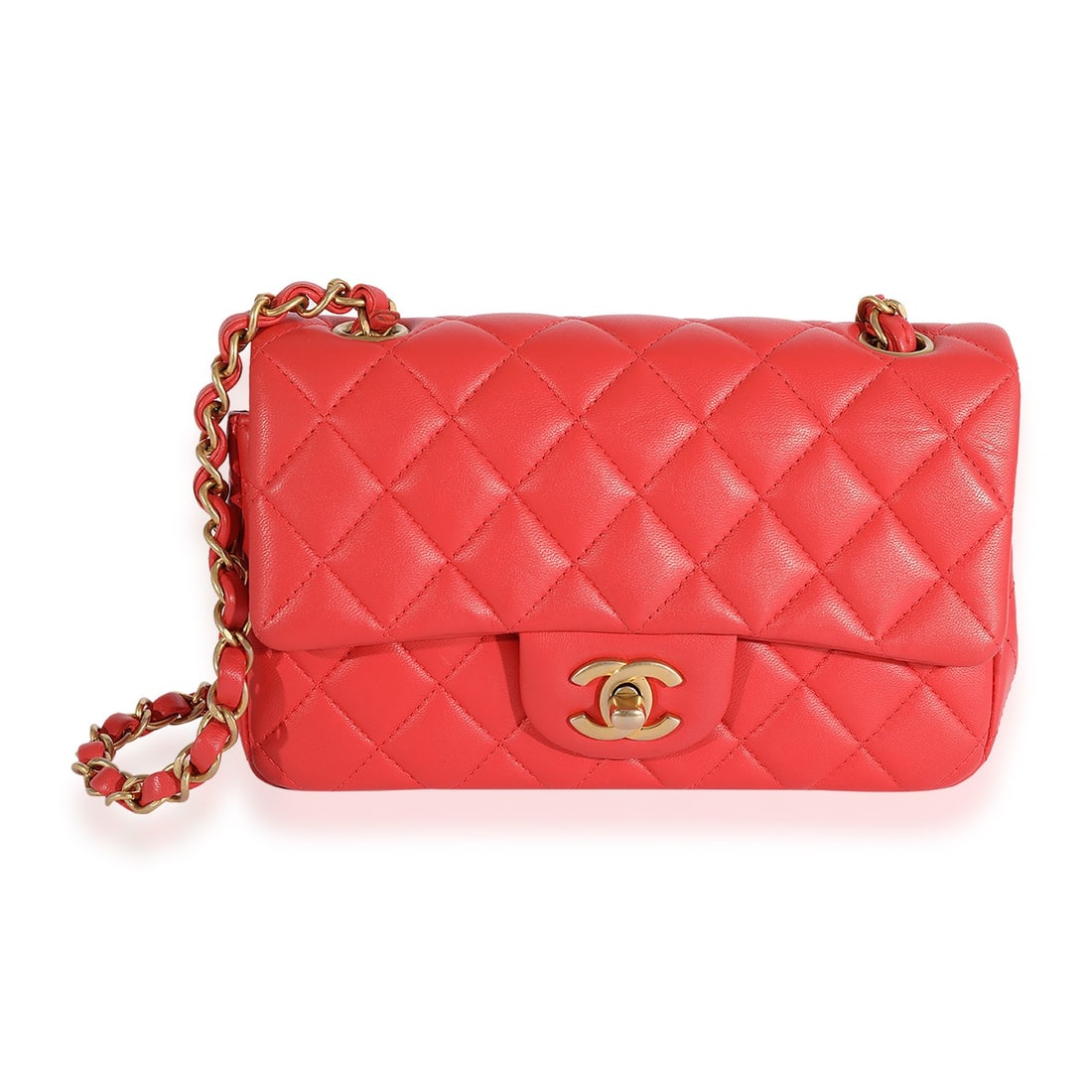 Chanel Classic Flap Mini Rectangular Crossbody in Pink Lambskin: Chanel Classic Flap Mini Rectangular Crossbody in Pink Lambskin Pre-owned Chanel Classic Flap mini rectangular bag in coral quilted lambskin with a turnlock closure and gold-tone hardware. Designed fo