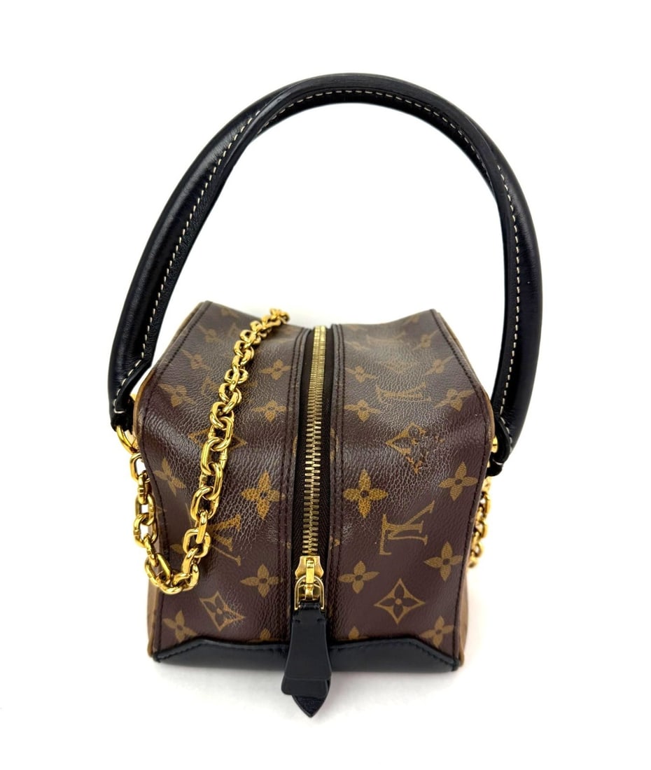 Louis Vuitton Square Shoulder Bag Reverse Monogram Small: Louis Vuitton Square Shoulder Bag Reverse Monogram Small This Louis Vuitton Reverse Monogram Square Shoulder Hand Bag features a compact square shape with a brown monogram-coated canvas exterior. The 