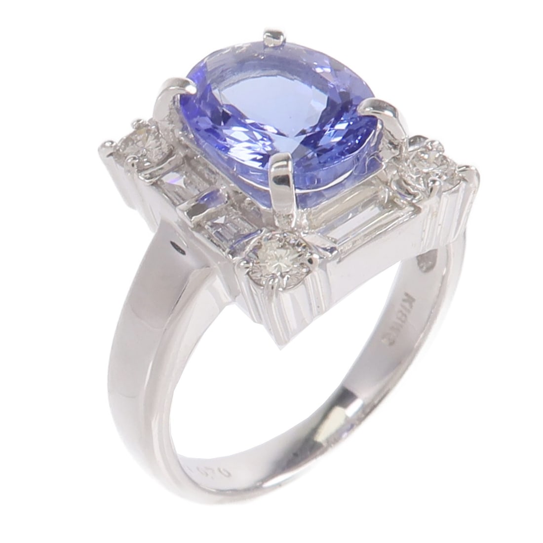 18K White Gold Tanzanite Diamond Ring US Size 5: 18K White Gold Tanzanite Diamond Ring US Size 5 A Tanzanite and diamond ring in 18K white gold, presented in a purple color tone. The ring is size US 5 and has a very good AB condition. Accessories ar