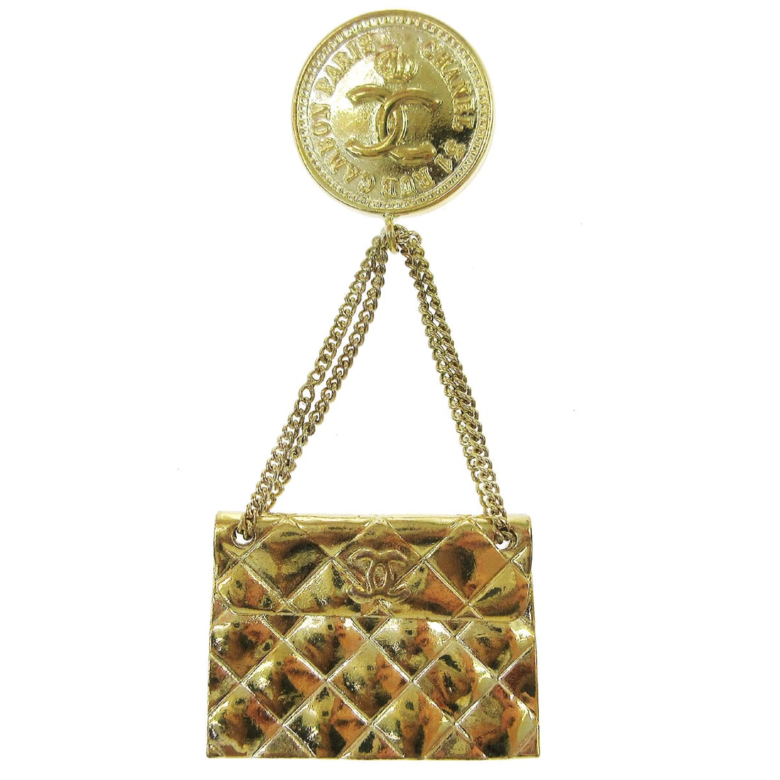 Chanel Gold Tone Bag Motif Brooch Pin France: Chanel Gold Tone Bag Motif Brooch Pin France Gold-tone brooch in a bag motif, made in France. This piece features a handbag-inspired design with visible wear consistent with prior use. Specifications 