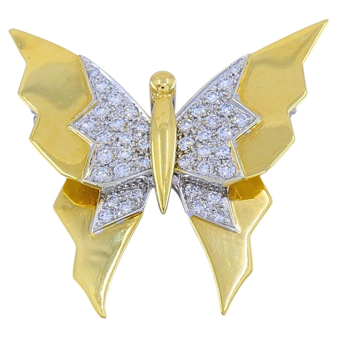 Pomellato Butterfly Brooch in 18k Gold with Diamonds: Pomellato Butterfly Brooch in 18k Gold with Diamonds Vintage Pomellato butterfly brooch crafted in 18k yellow gold and set with round-cut pave diamonds in white gold. The design features an angular bu