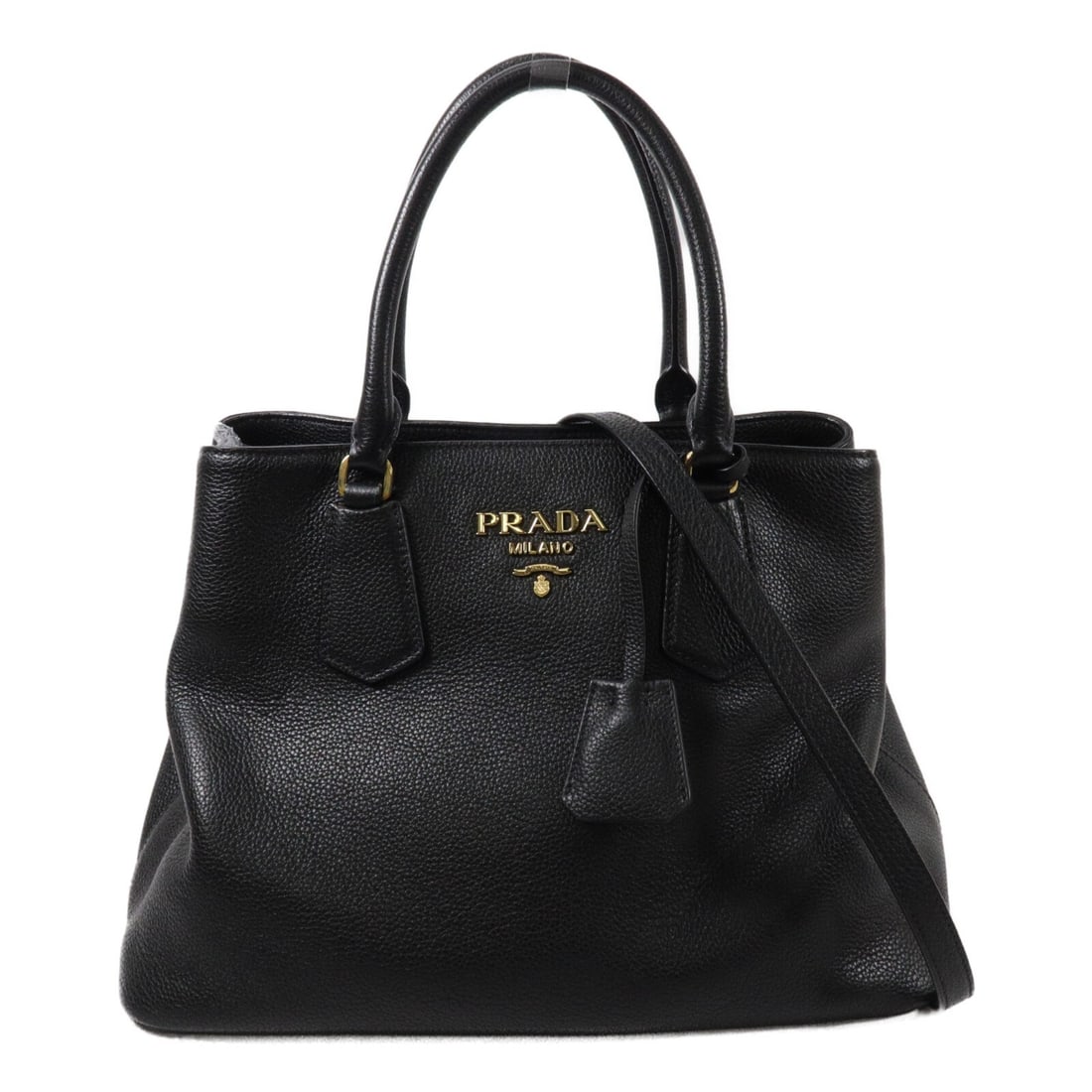PRADA Vitello Daino black calfskin 2 way shoulder bag GHW: PRADA Vitello Daino black calfskin 2 way shoulder bag GHW Prada Vitello Daino 2-way shoulder bag in black calfskin leather with a structured design and dual carry options. The interior includes one op