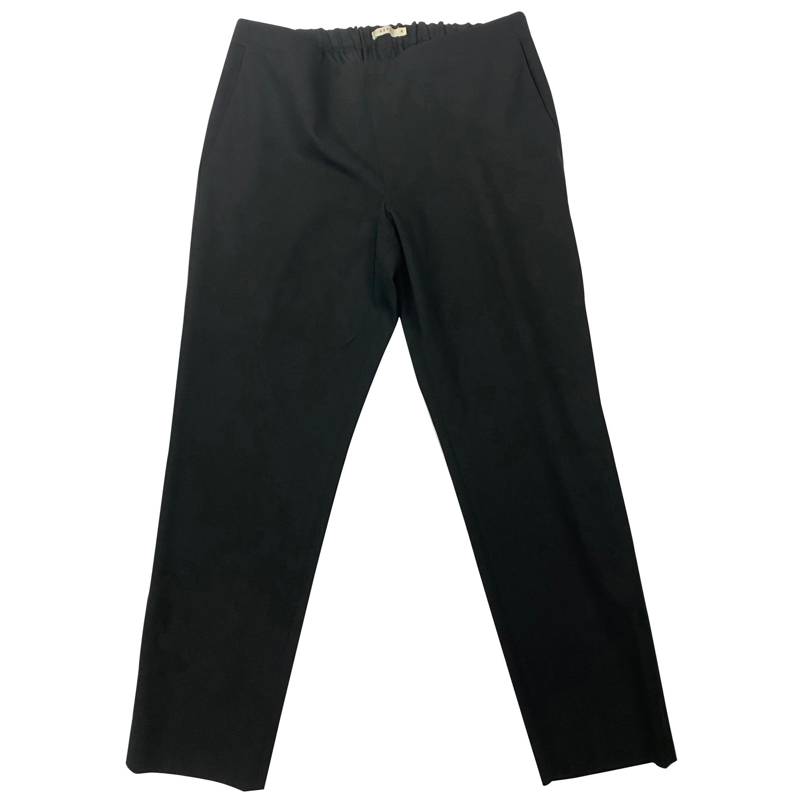 Black Wool Pants Size M by 6397 Made in USA: Black Wool Pants Size M by 6397 Made in USA Black wool trousers in size M (US), made in the United States. The pants are crafted from 96% wool and feature a black color, stretchy elastic at the back o