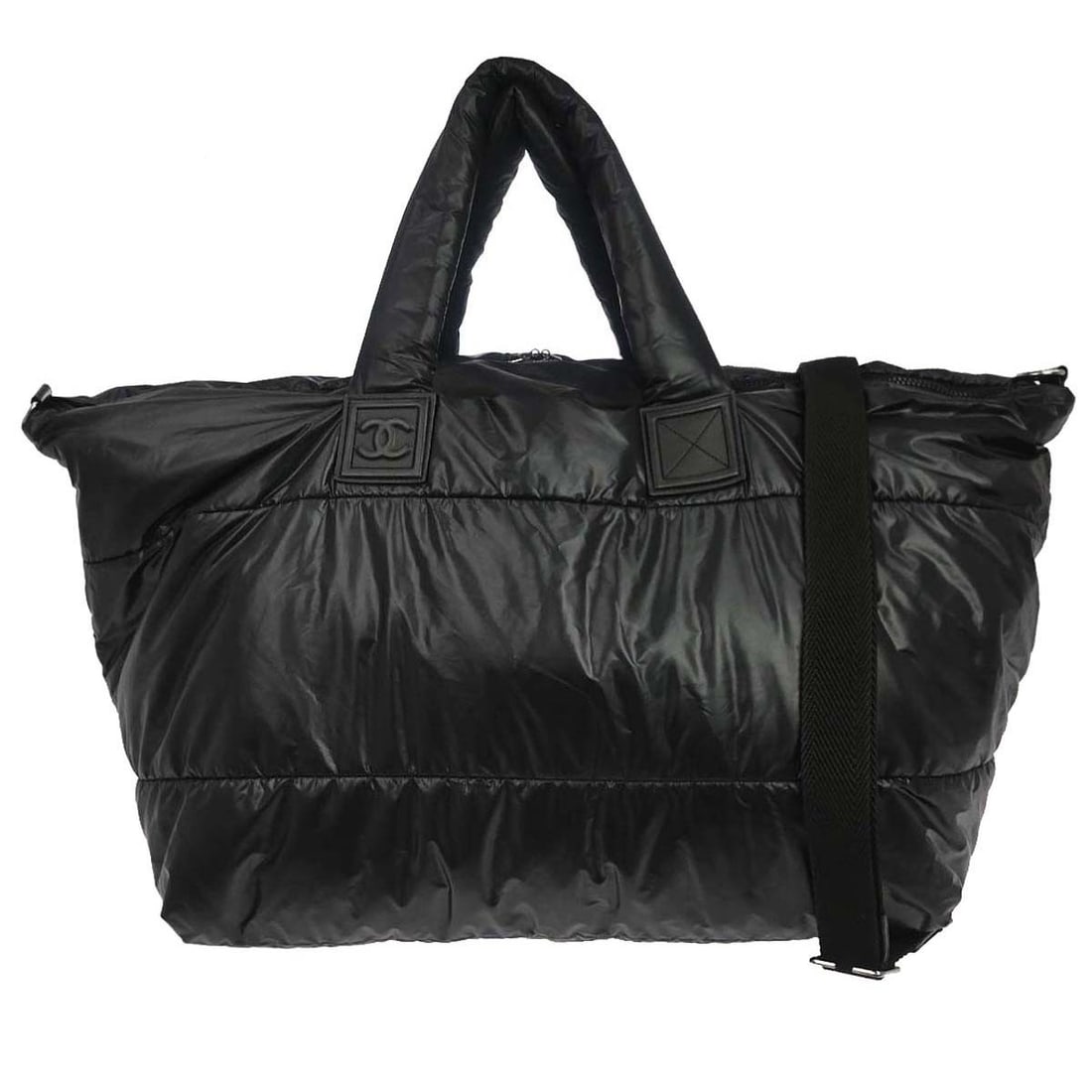 CHANEL Coco Cocoon Large Black Nylon 2way Tote with Strap: CHANEL Coco Cocoon Large Black Nylon 2way Tote with Strap This Chanel Coco Cocoon 2way tote bag is crafted in black nylon with leather accents and a logo detail. It features inner pockets, an outside 