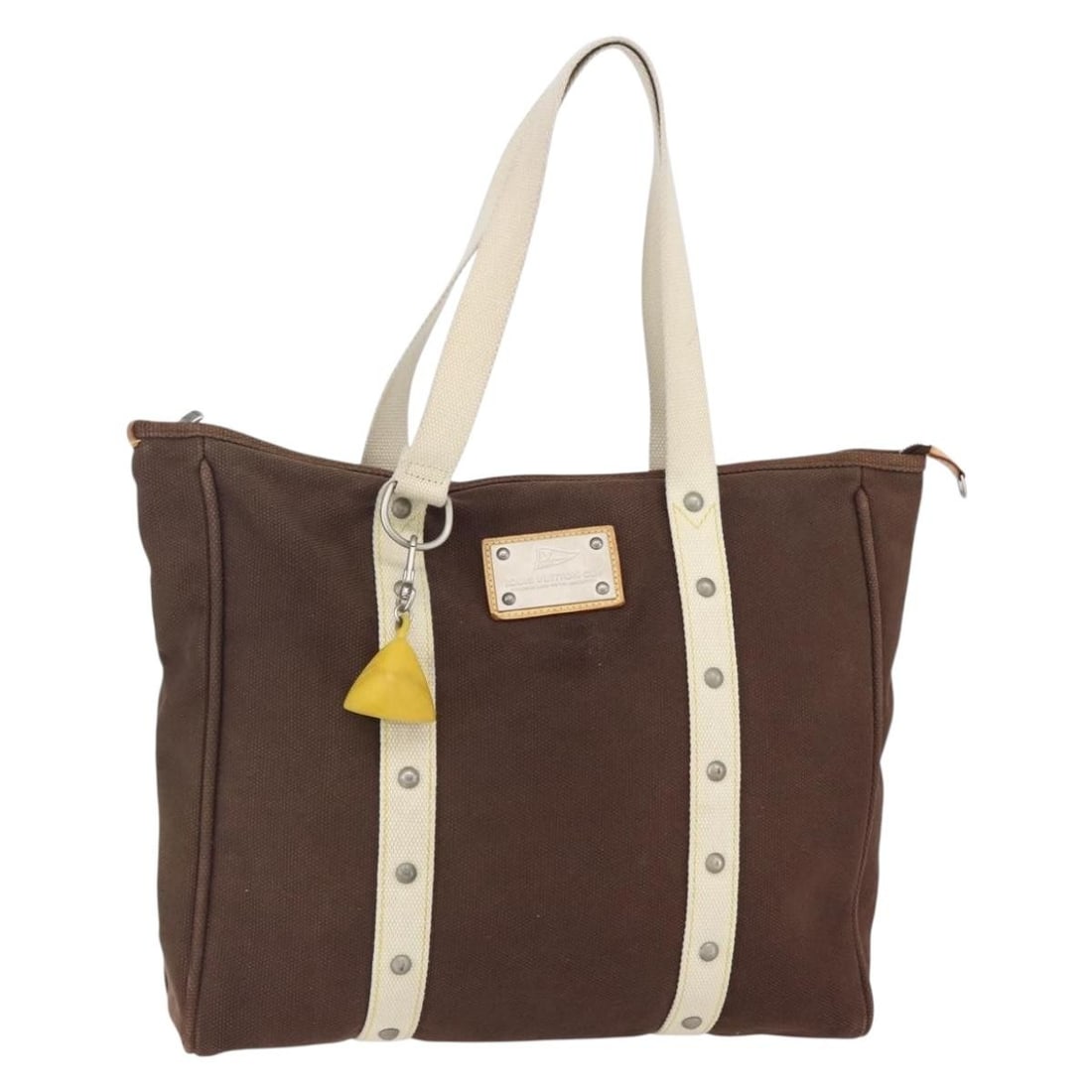 Louis Vuitton Antigua Brown Canvas Tote Bag France: Louis Vuitton Antigua Brown Canvas Tote Bag France This Louis Vuitton Antigua Tote is crafted from brown canvas and is designed for women. Made in France, this pre-owned bag is in good condition with 