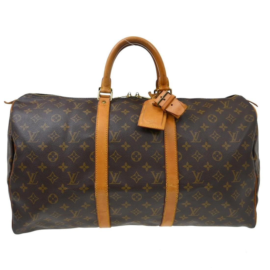 Louis Vuitton Keepall Brown Monogram Canvas Travel Bag: Louis Vuitton Keepall Brown Monogram Canvas Travel Bag Louis Vuitton Keepall in brown monogram canvas. This unisex bag is in good condition with visible wear. The exterior shows scuffs, cracks, tears,