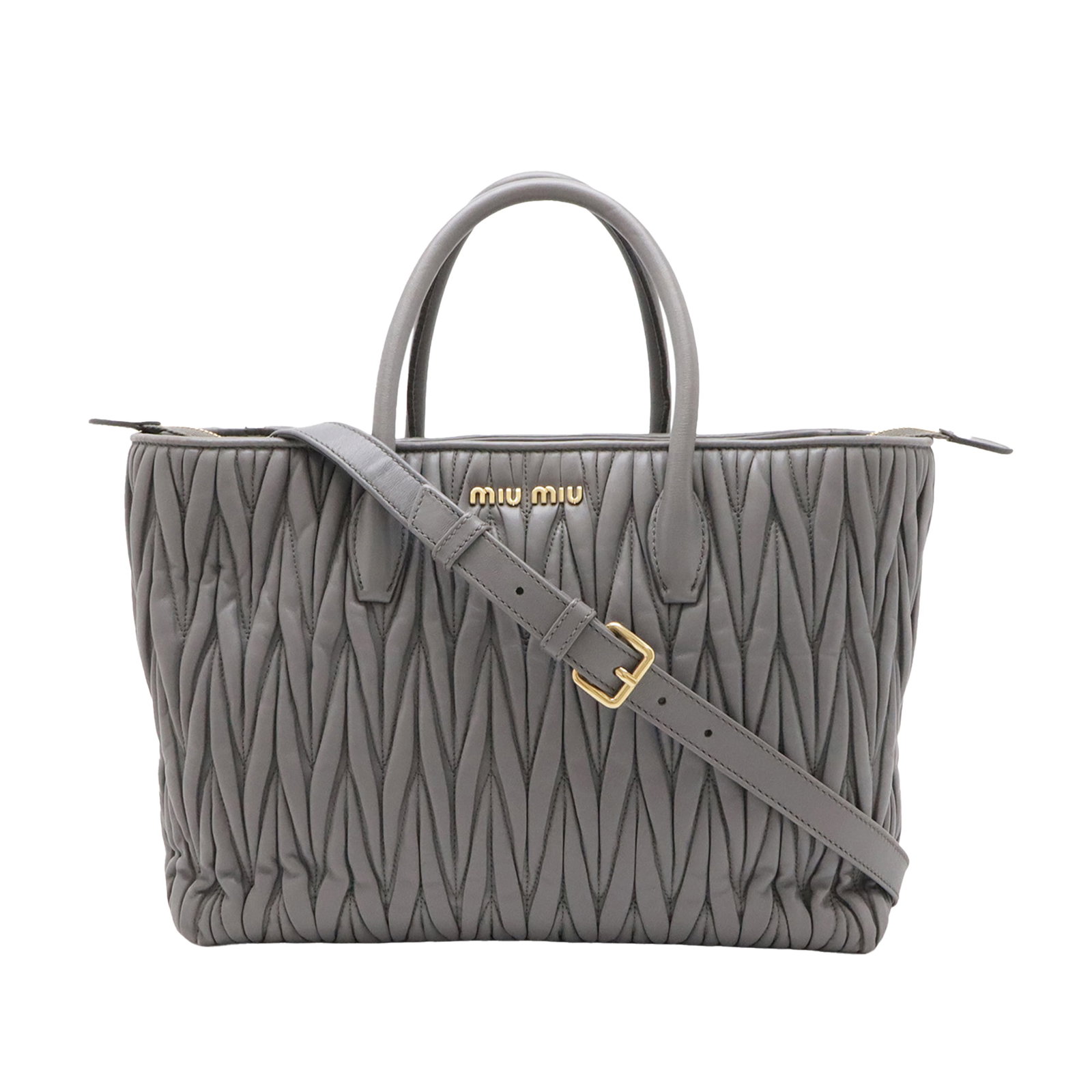 Gray Leather Satchel Miu Miu Matelasse Nappa: Gray Leather Satchel Miu Miu Matelasse Nappa Miu Miu Matelasse Nappa satchel in gray quilted leather with rolled handles, a top zip closure, and an interior slip pocket. Made in Italy. Condition AB wi