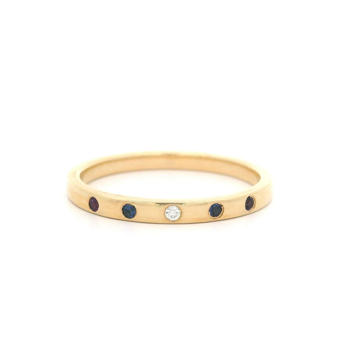 14k Yellow Gold Petite Birthstone Stackable Ring with Amethyst Sapphire: 14k Yellow Gold Petite Birthstone Stackable Ring with Amethyst Sapphire Adorn your finger with this elegant and petite 14k Yellow Gold stackable band ring, showcasing a vibrant combination of colorful