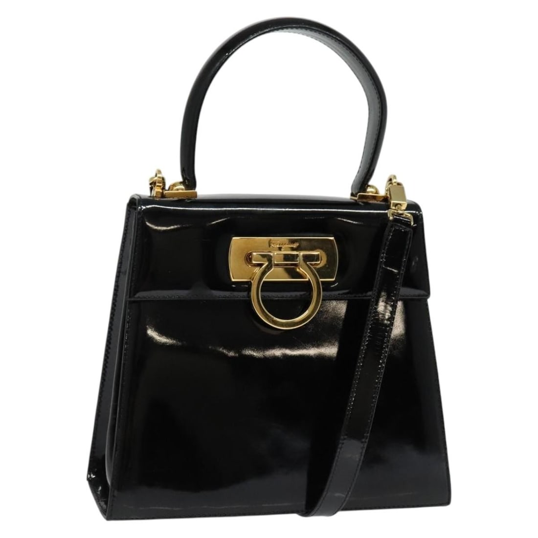 Gancini Black Patent Leather Convertible Bag by Salvatore Ferragamo: Gancini Black Patent Leather Convertible Bag by Salvatore Ferragamo This Salvatore Ferragamo Gancini Convertible Top Handle Bag is crafted from black patent leather and designed for women. It features