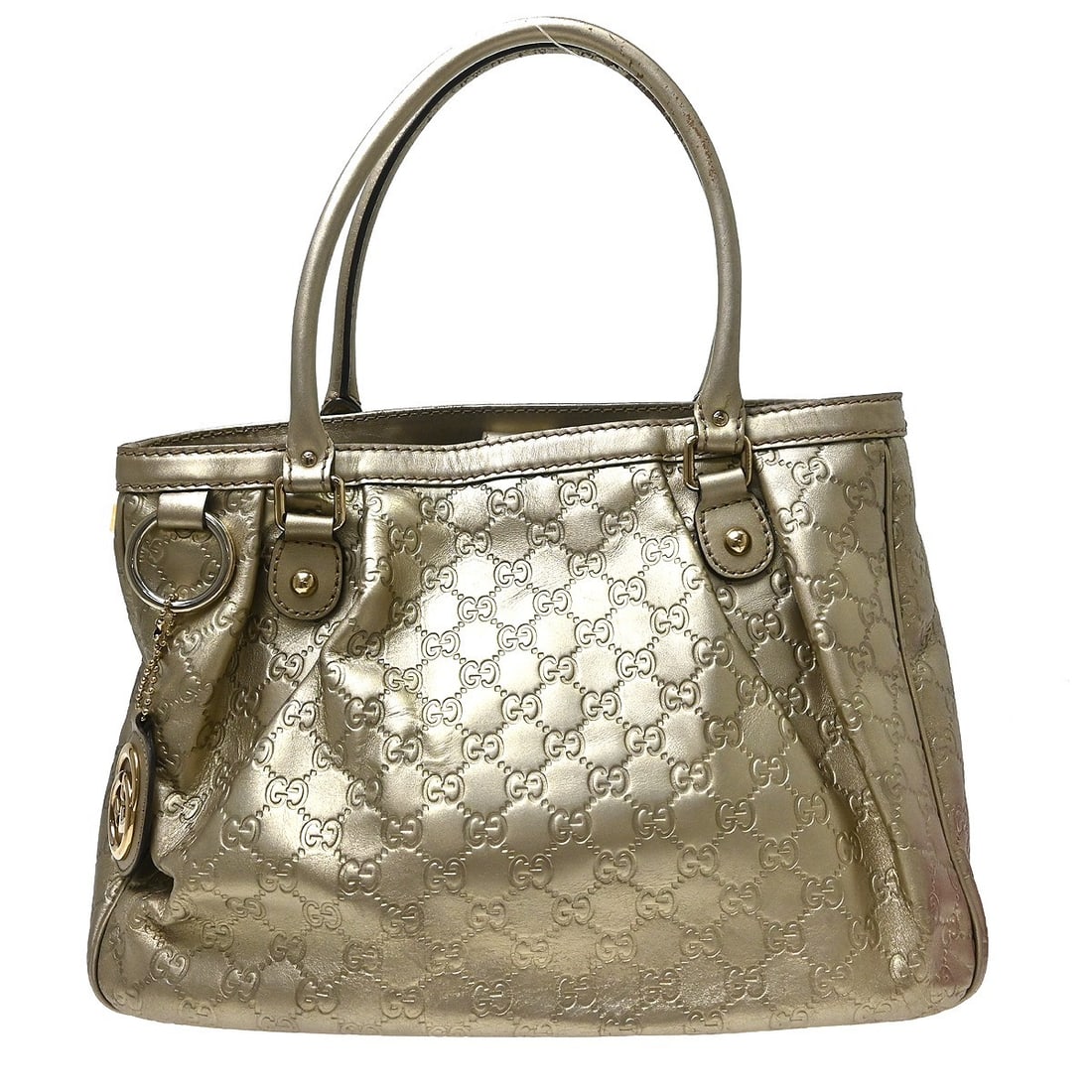 Gucci Guccissima Leather Hobo Bag in Gold with Bag Charm: Gucci Guccissima Leather Hobo Bag in Gold with Bag Charm Gucci Gold Guccissima Leather Tote Handbag in large size, made in Italy. It features a gold Guccissima leather exterior with a beige lining, Gu