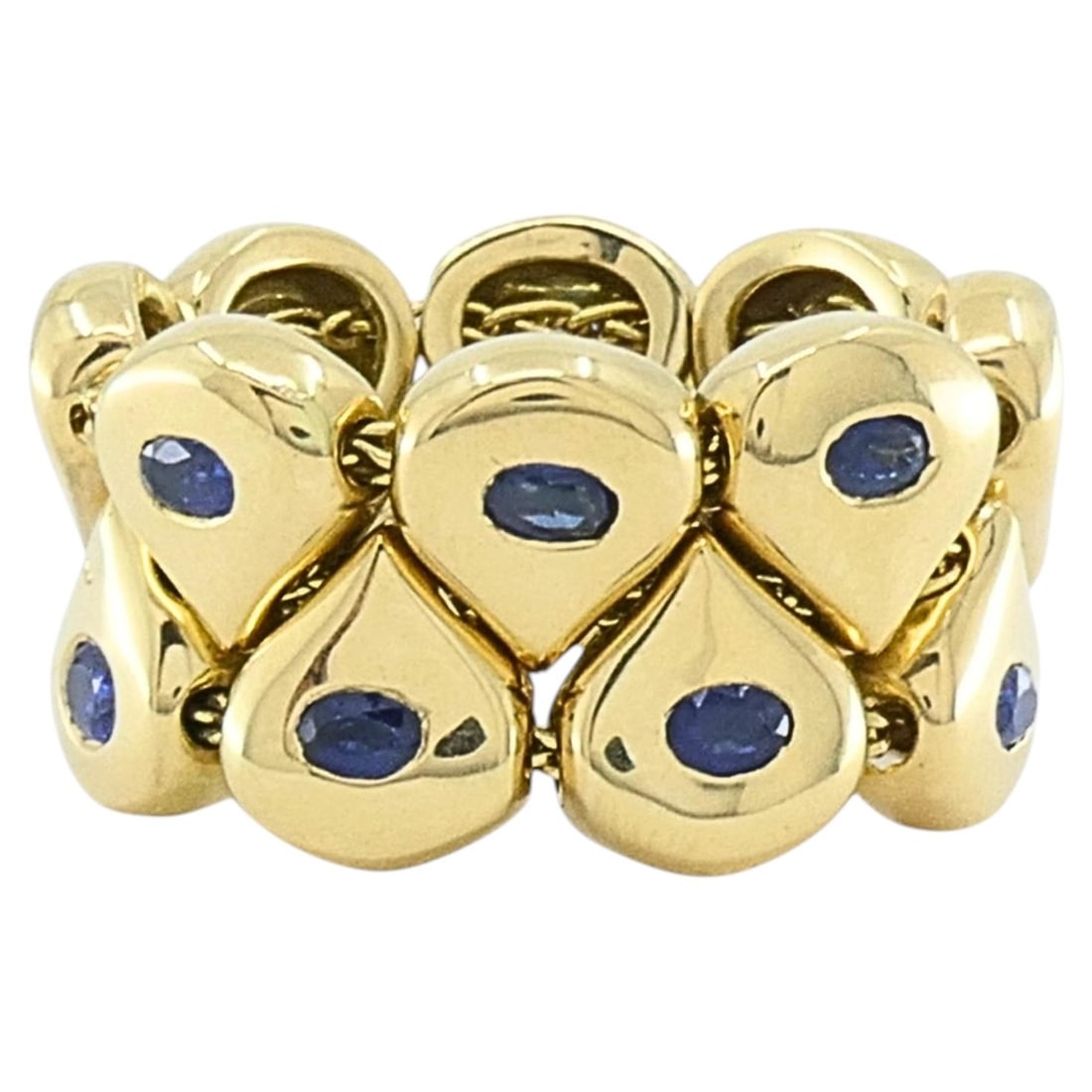 Chaumet Tsouka 18k Gold Sapphire Teardrop Link Ring: Chaumet Tsouka 18k Gold Sapphire Teardrop Link Ring Vintage Chaumet Paris Tsouka ring from the 1990s, designed as a flexible band of articulated teardrop links. It features oval blue sapphires set in 