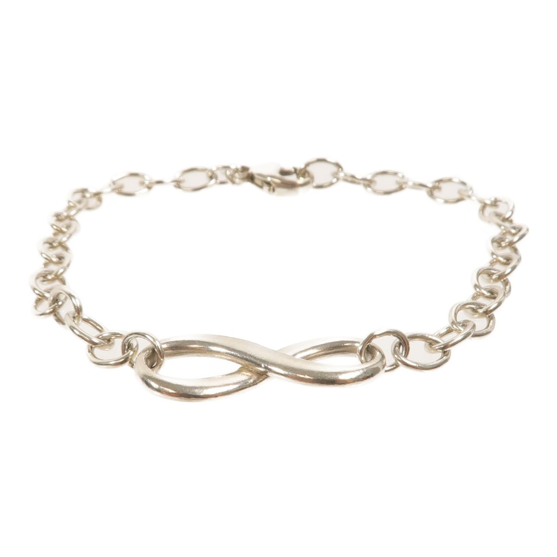 Tiffany Co Infinity Sterling Silver 925 Bracelet: Tiffany Co Infinity Sterling Silver 925 Bracelet Tiffany & Co. Infinity bracelet in 925 sterling silver with a clean silver-tone finish and no main stone. Made in the United States, this women's brace