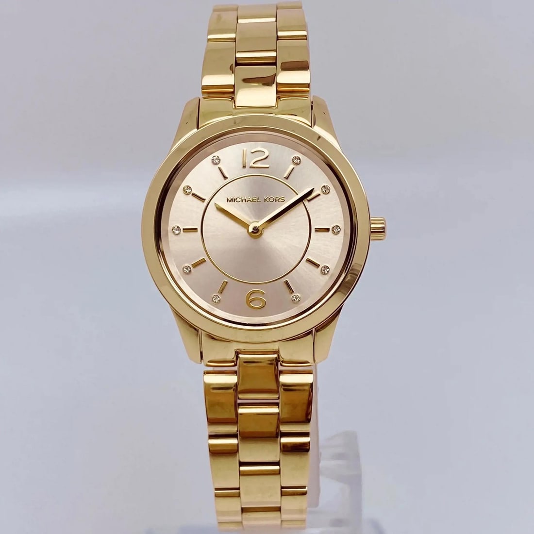 Michael Kors Runway Womens Quartz Bracelet Watch Champagne Dial MK6590: Michael Kors Runway Womens Quartz Bracelet Watch Champagne Dial MK6590 Michael Kors Runway ladies quartz wristwatch with a champagne sunburst analog dial, gold-tone stainless steel case and bracelet, 